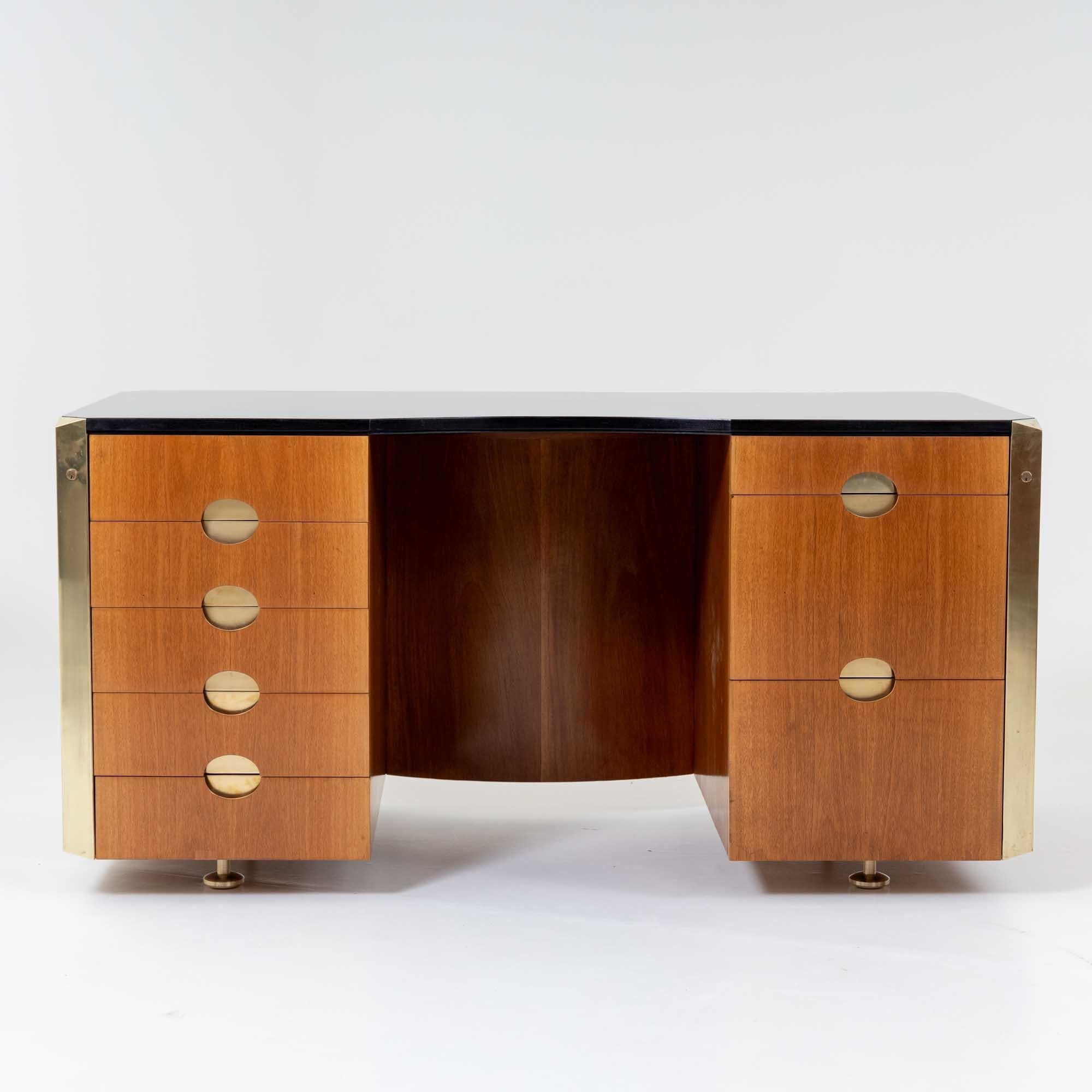 Large desk, designed by Luigi Caccia Dominioni for Azucena in the 1960s. The desk stands on brass legs that are set back under the drawer elements, giving it an elegant, floating character. The total of eight drawers at the front offer plenty of