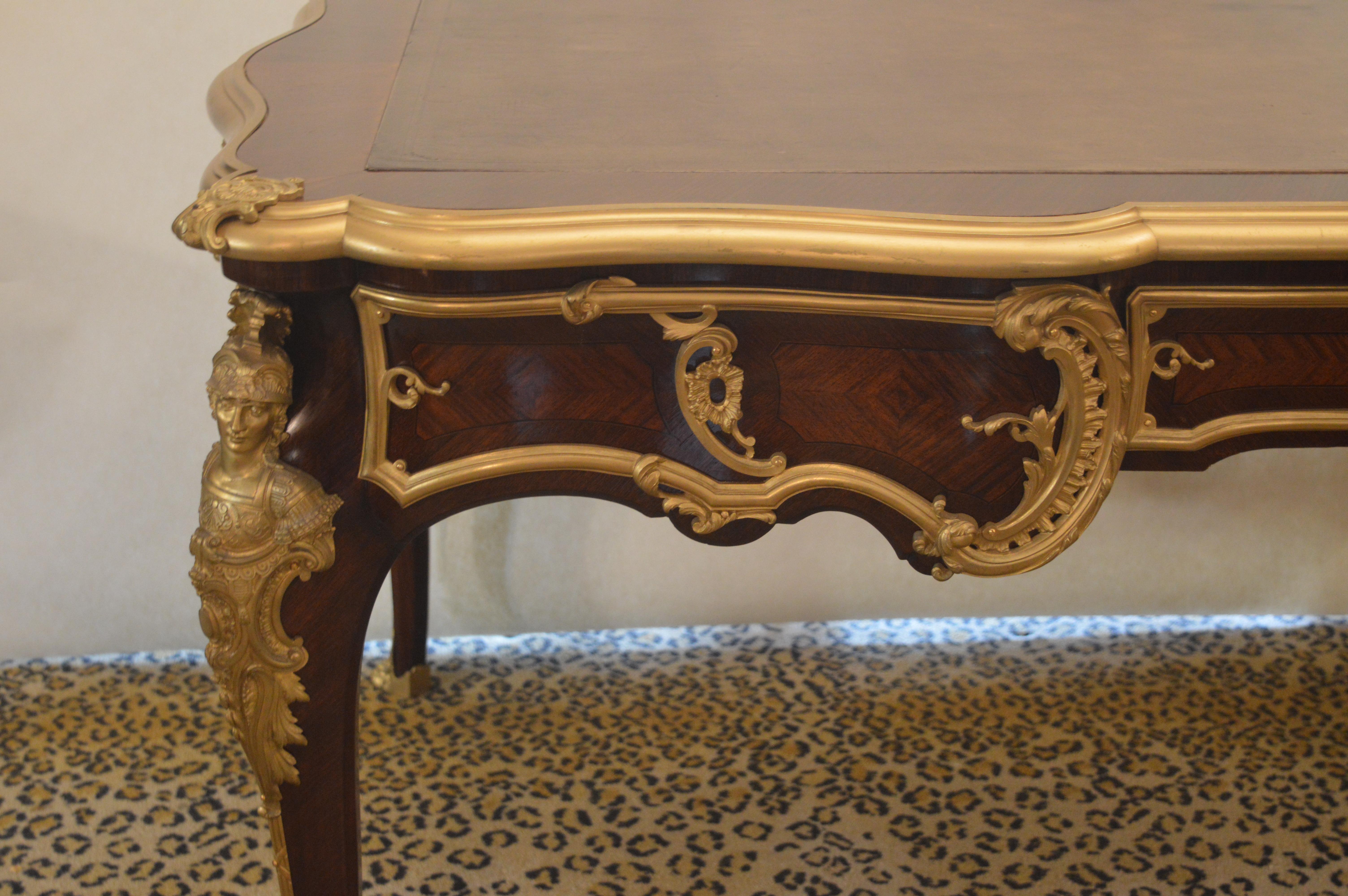 19th century desk signed P. Sormani. Parquetry with a dark brown leather top. Gilded bronze