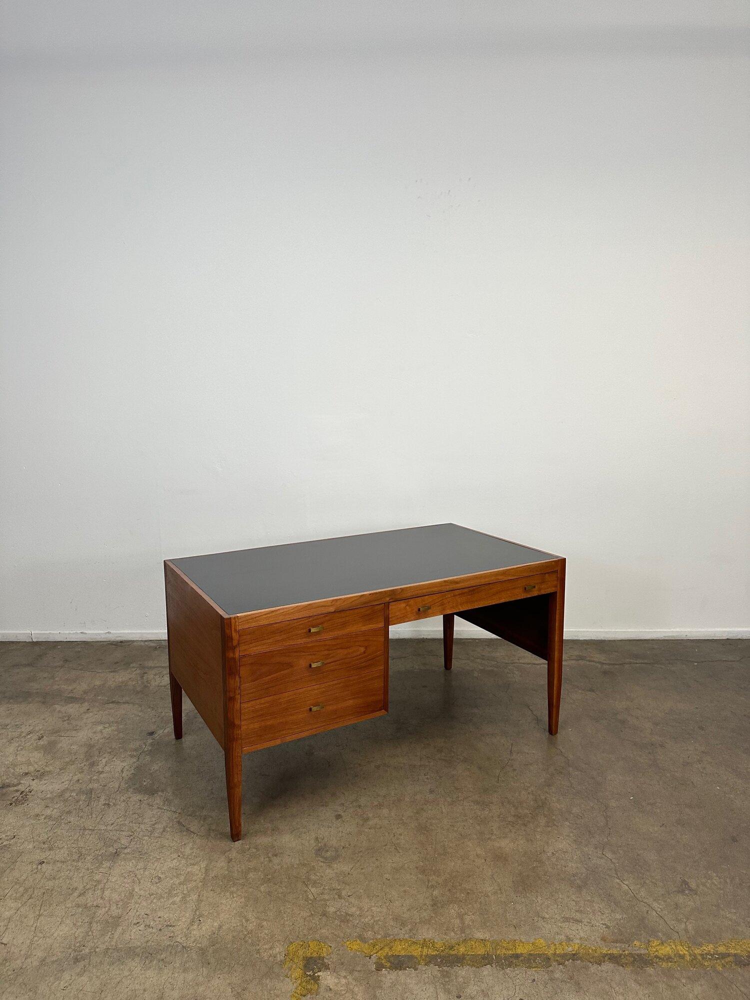 Fully restored desk finished on all side very reminiscent of mid  century designs by Cavalier. Item shows in excellent structural condition and is fully functional. Aesthetically item shows well and has been fully refinished but may show  very minor