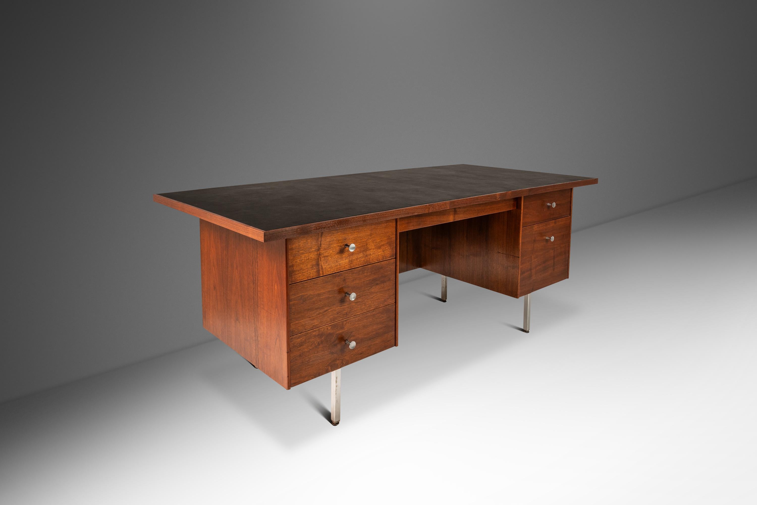 Introducing an extraordinary executive desk fresh out of our restoration shop. Originally built in the 1960's by the small Costa Mesa Furniture Co. based out of Anaheim this minimalist desk has undergone a comprehensive and transformative