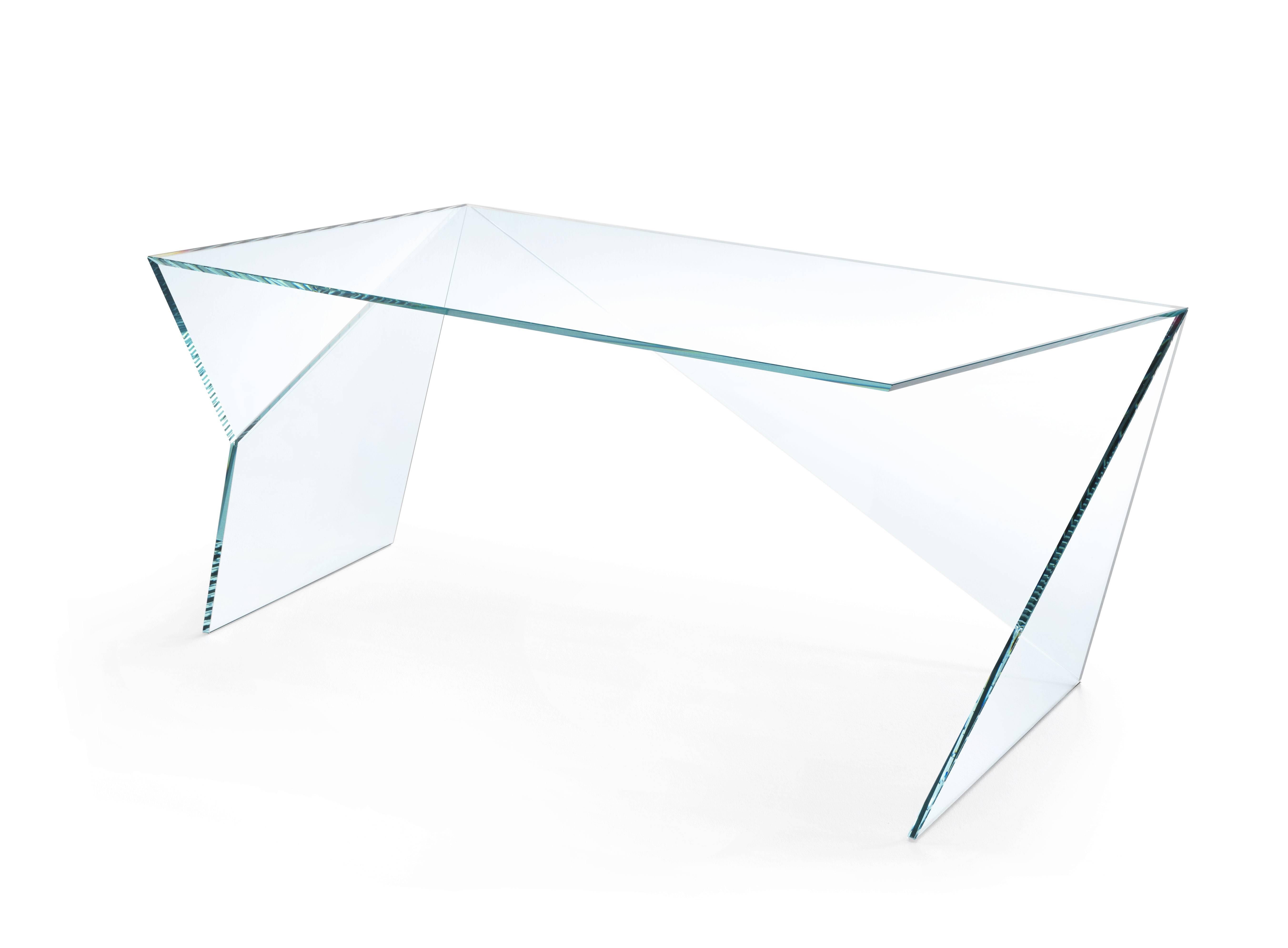 The executive desk 'Origami' is made of extra-clear crystal glass. Each sheet of extra-clear crystal glass is cut and ground with extreme precision, then the sheets are assembled by hand, having to fit together perfectly, the gluing operation