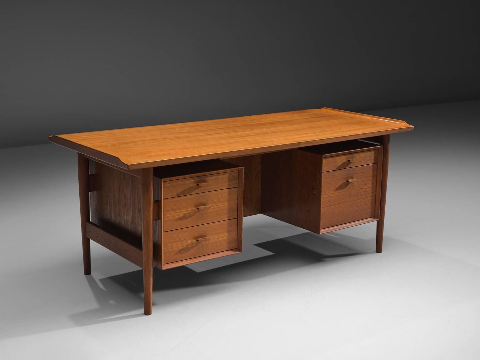 Executive desk, in teak, by Arne Vodder for Sibast, Denmark 1960s. 

This luxurious piece was designed by one of the best designers Denmark has known, and is produced by Sibast. Vodder designed a large series of desks for this company, including