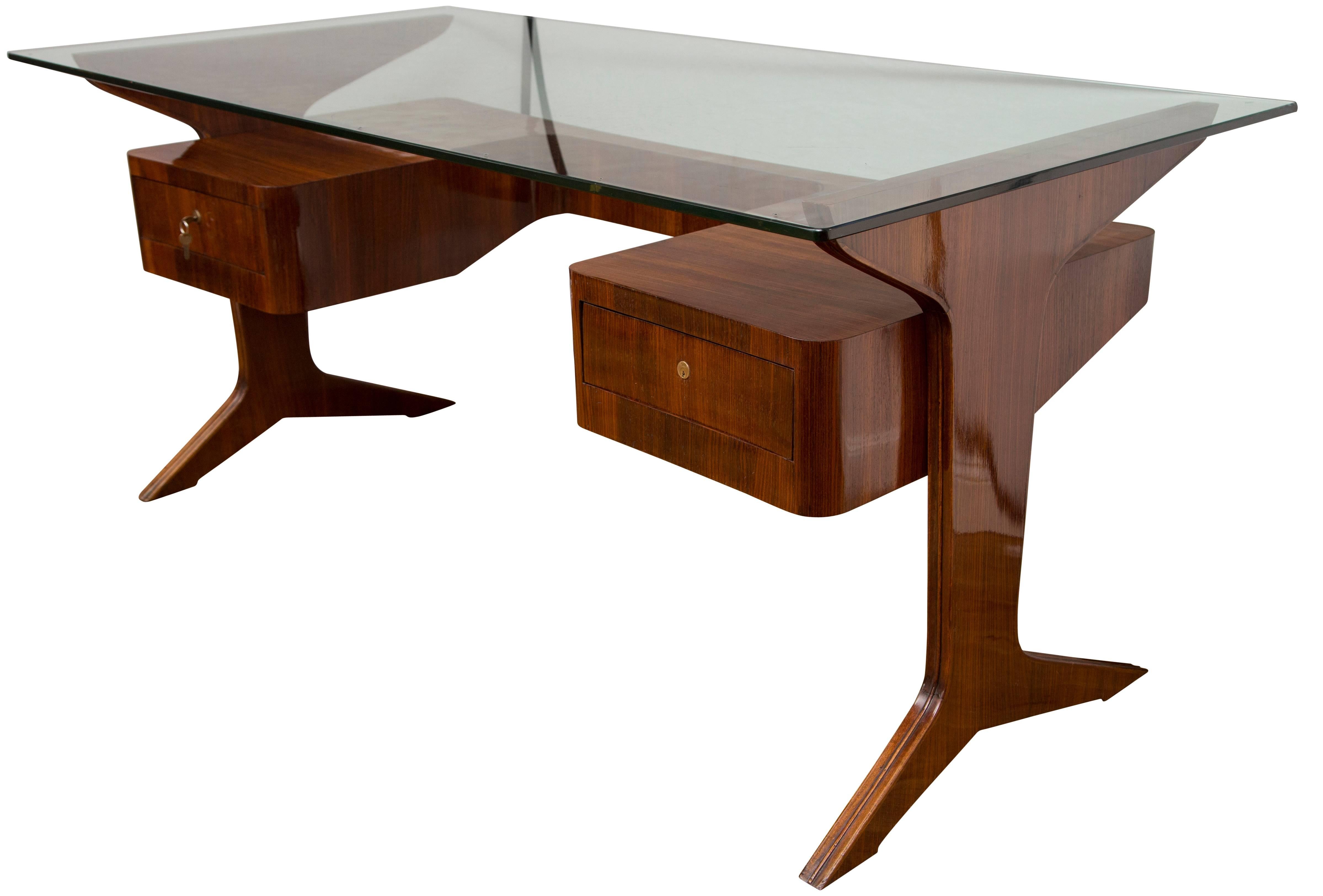 Fabulous vintage free floating desk with original glass blown top upheld by a sleek and clean rosewood two drawer table base, note the curved back.
Dating: 1958 ca
Origin: Italy
Condition: The wood veneer is in excellent condition, however the glass