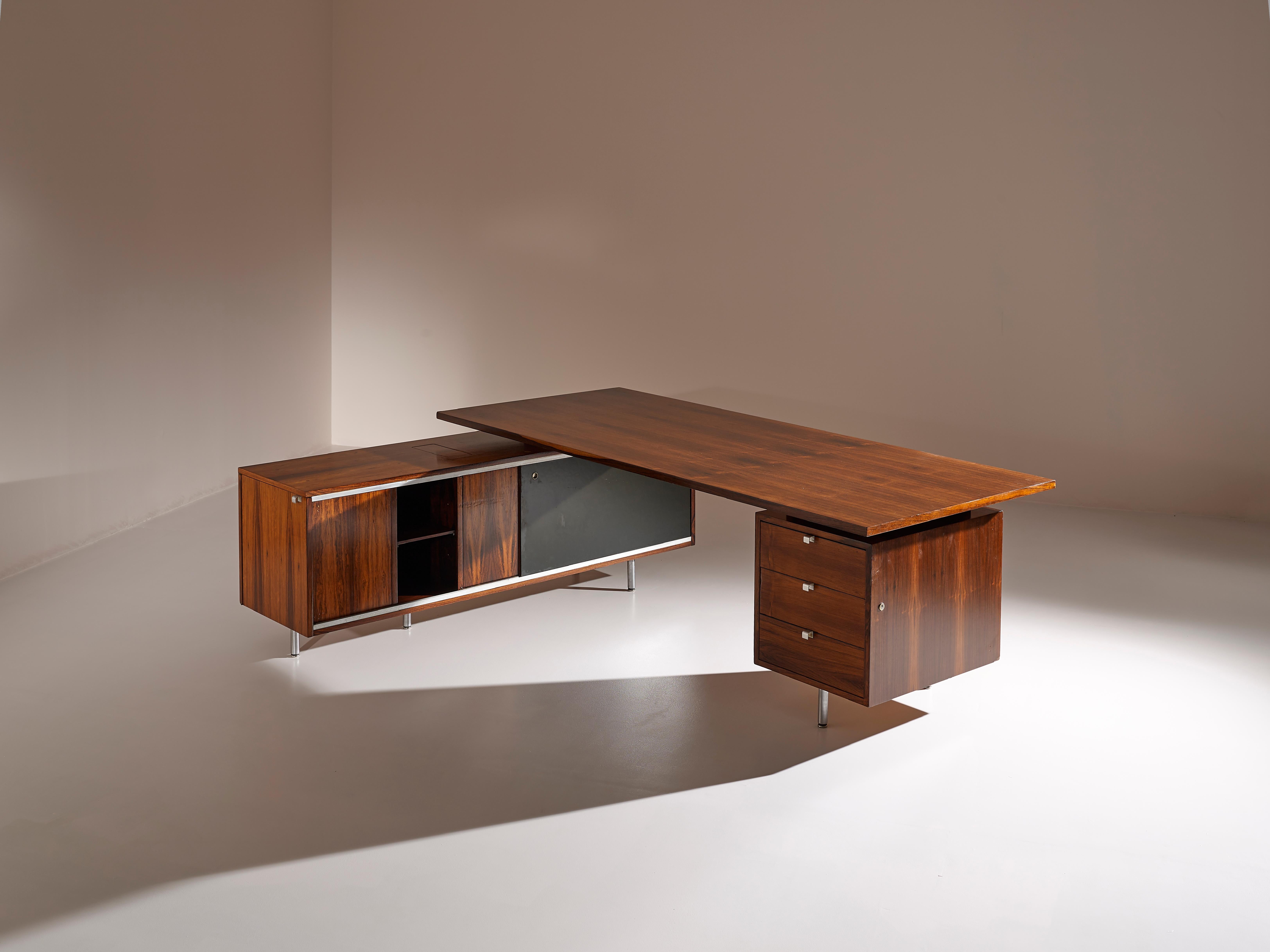 A rare and large Mid-Century Modern L-shaped executive desk designed by George Nelson for Herman Miller in the 1960s

The desk features an amazing rosewood wood grain, with polished stylish metal feet and hardware. Its sideboard provides vast