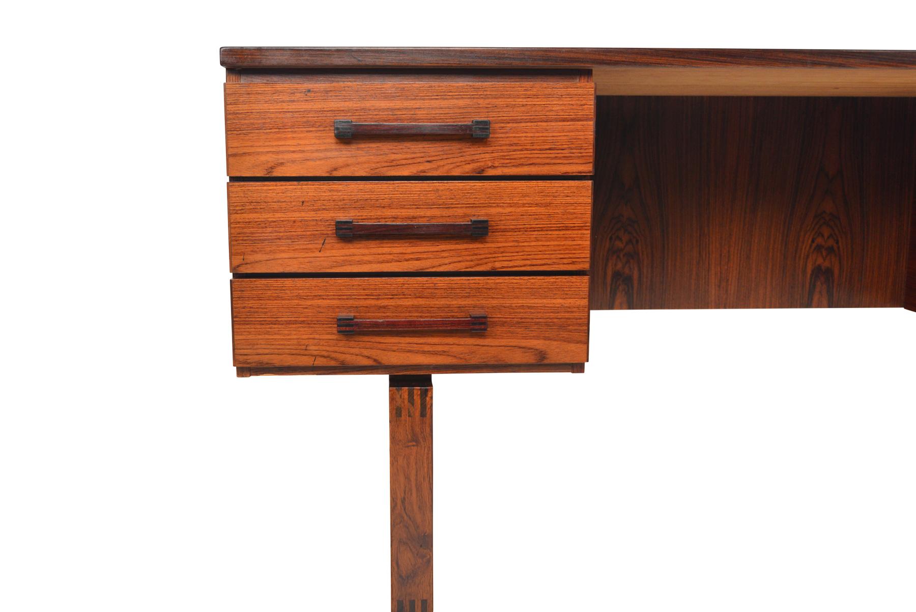 Origin: Denmark
Designer: Henning Jensen and Torben Valeur
Manufacturer: Dyrlund
Era: 1960s
Materials: Rosewood
Dimensions: 61? wide x 29.5? deep x 29? tall
Kneehole: 27? wide x 19? deep x 27? tall

Condition: In excellent original condition