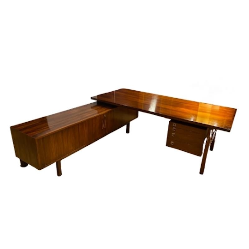 A rare and exceptional 1960's executive writing desk designed by Arne Vodder, crafted from rosewood. This sophisticated piece showcases the elegance and functionality of mid-century Danish design, featuring clean lines, a floating design work top,