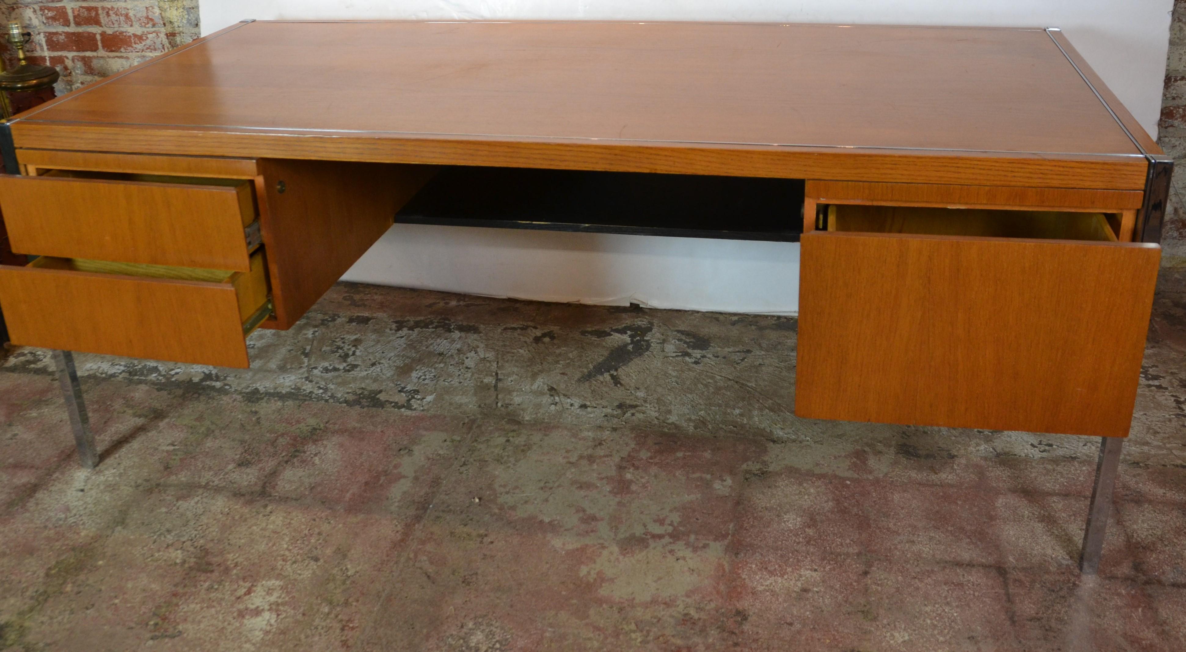 Very good quality executive style teak wood, chrome accents desk. Keys are not included.