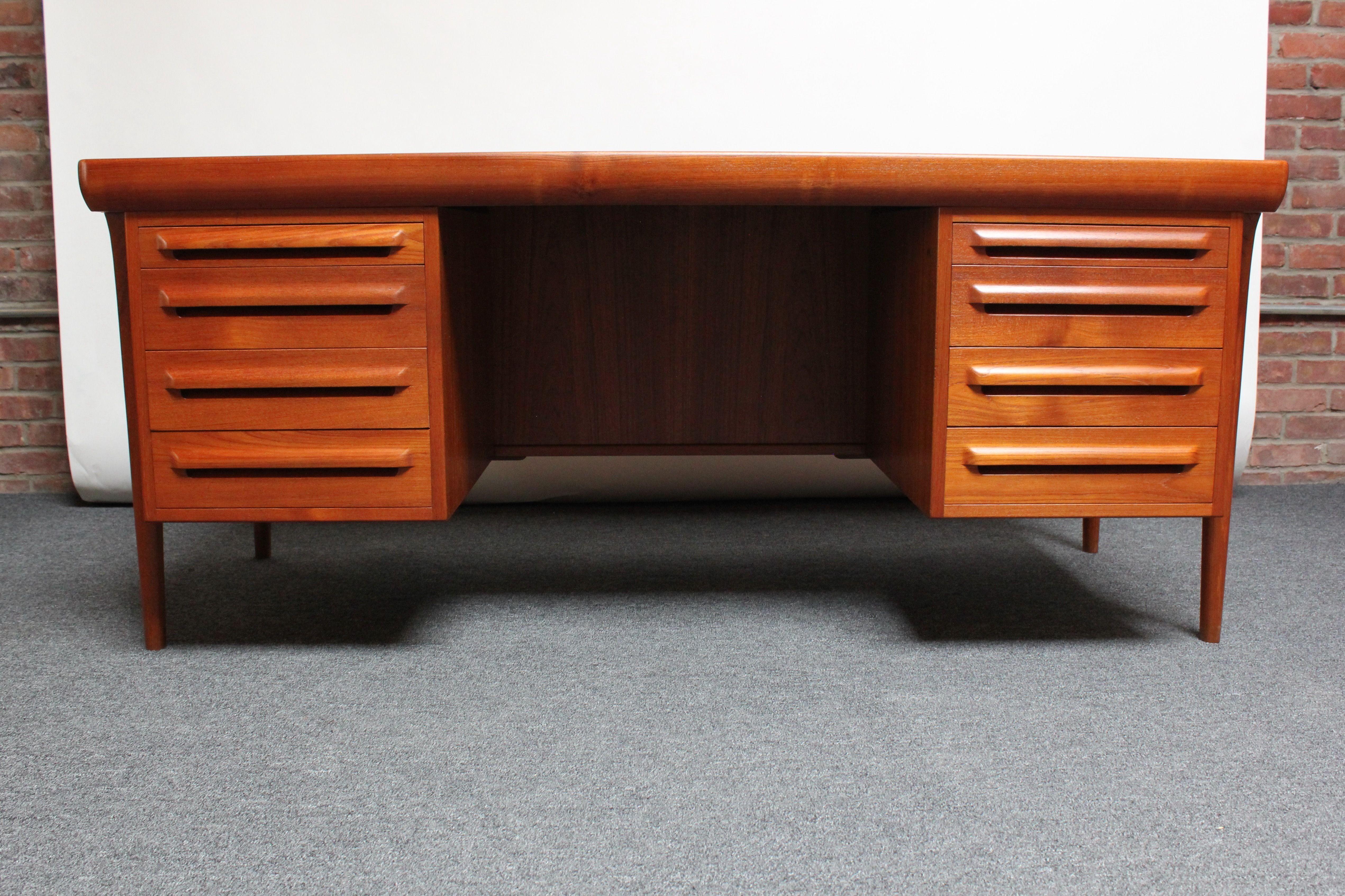 Large teak executive desk model #12 designed in the 1960s by K.B. Simonsen for Faarup Møbelfabrik.
Though highly regarded in Europe, Simonsen's furniture was rarely exported to the United States, since it was produced in relatively small