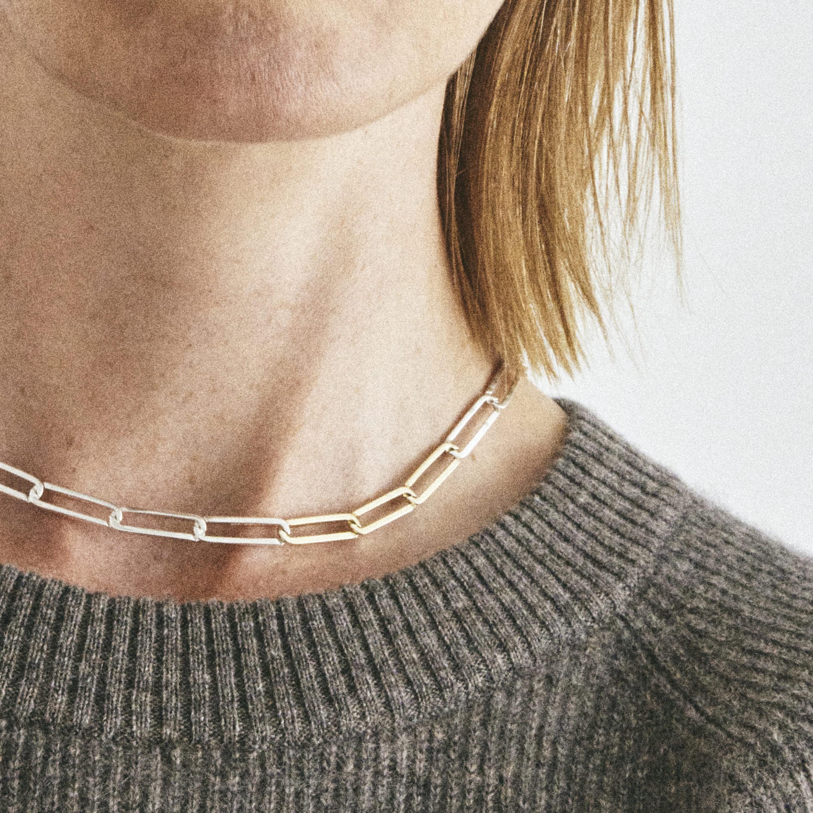 Also available in recycled 18k gold with 3 silver links and sterling silver.

A luxurious necklace in solid recycled sterling silver interposed with three links in solid, recycled 18k gold. The necklace has a relaxed fit, so you can wear it directly