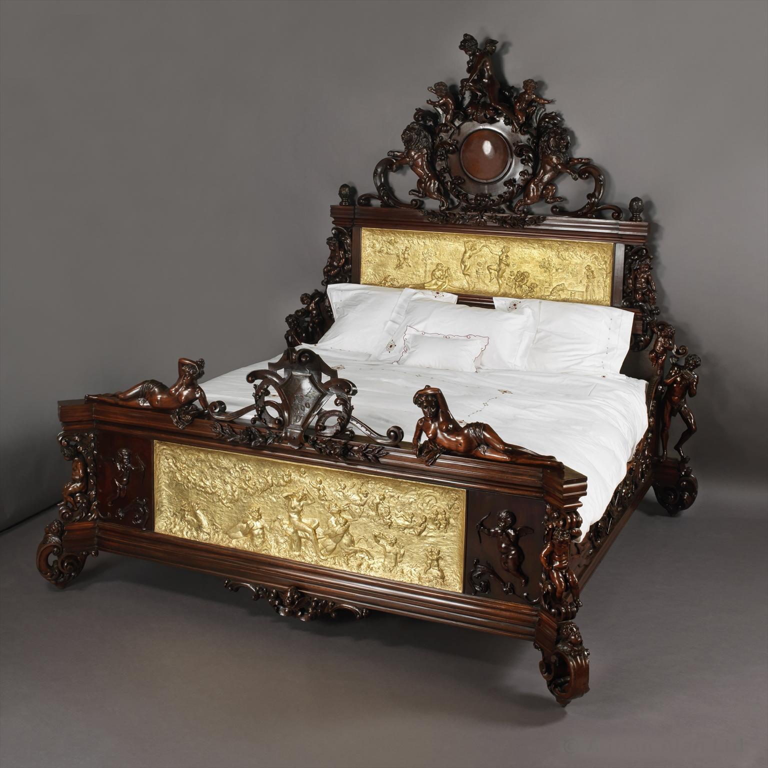 An Exceptional Exhibition Austrian Neo-Baroque Carved Mahogany Bed The Foot and Headboard Finely Carved With Figural Crests and Inset with Gilt-Bronze Relief Panels Depicting the Five Ages of Man and the Birth of Venus.

Austrian, Circa 1890. 

This