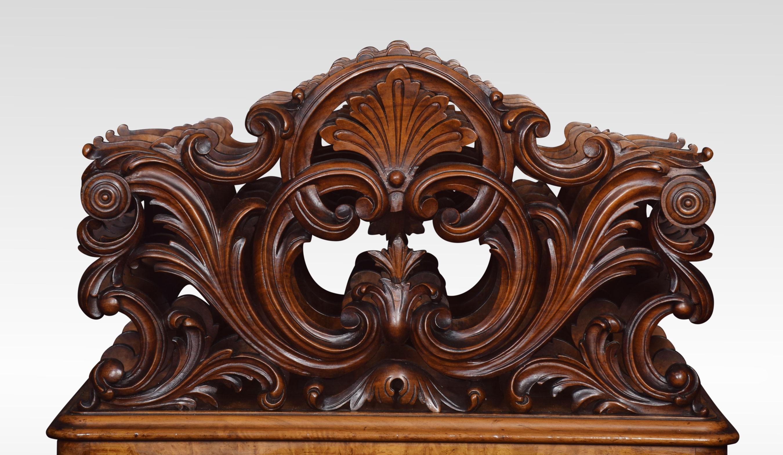 19th century figured walnut Canterbury, the outer carved foliate openwork dividers flanking a pair of inner silhouette dividers, above a rectangular moulded top and a single frieze drawer. All raised up on carved swept scrolling legs terminating in