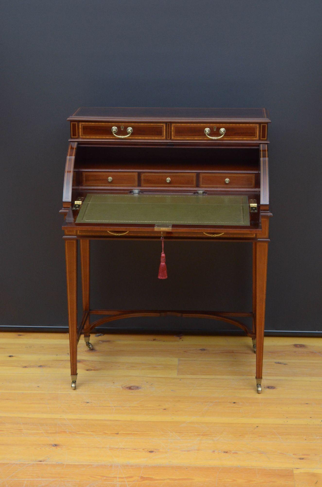 R031 Superb quality and very attractive, Edwardian flamed mahogany cylinder bureau by Maples & Co, two mahogany lined and satinwood crossbanded drawers fitted with original brass handles above a cylinder flamed mahogany front which open to reveal