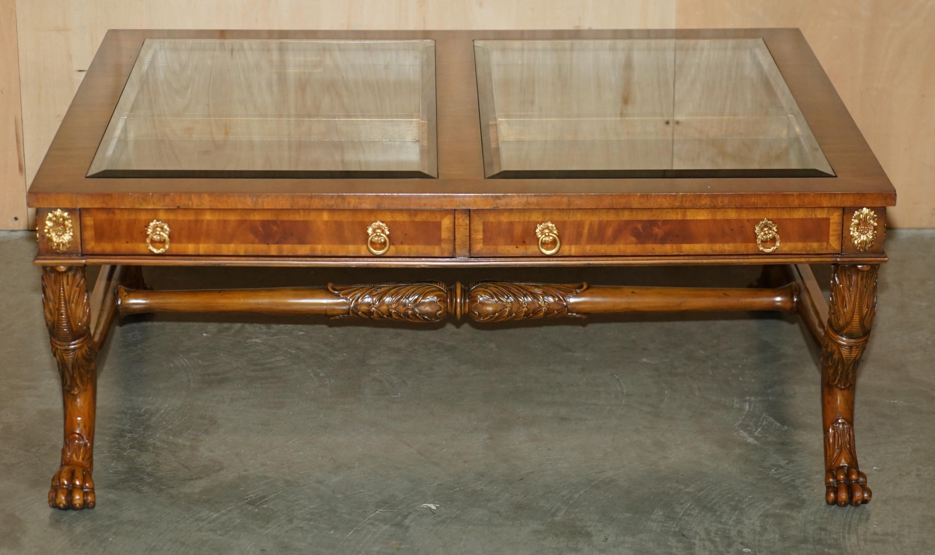 Royal House Antiques

Royal House Antiques is delighted to offer for sale this absolutely stunning, Regency taste hand carved with brass fixtures, Maitland Smith Exhibition case display top coffee or cocktail table 

Please note the delivery fee