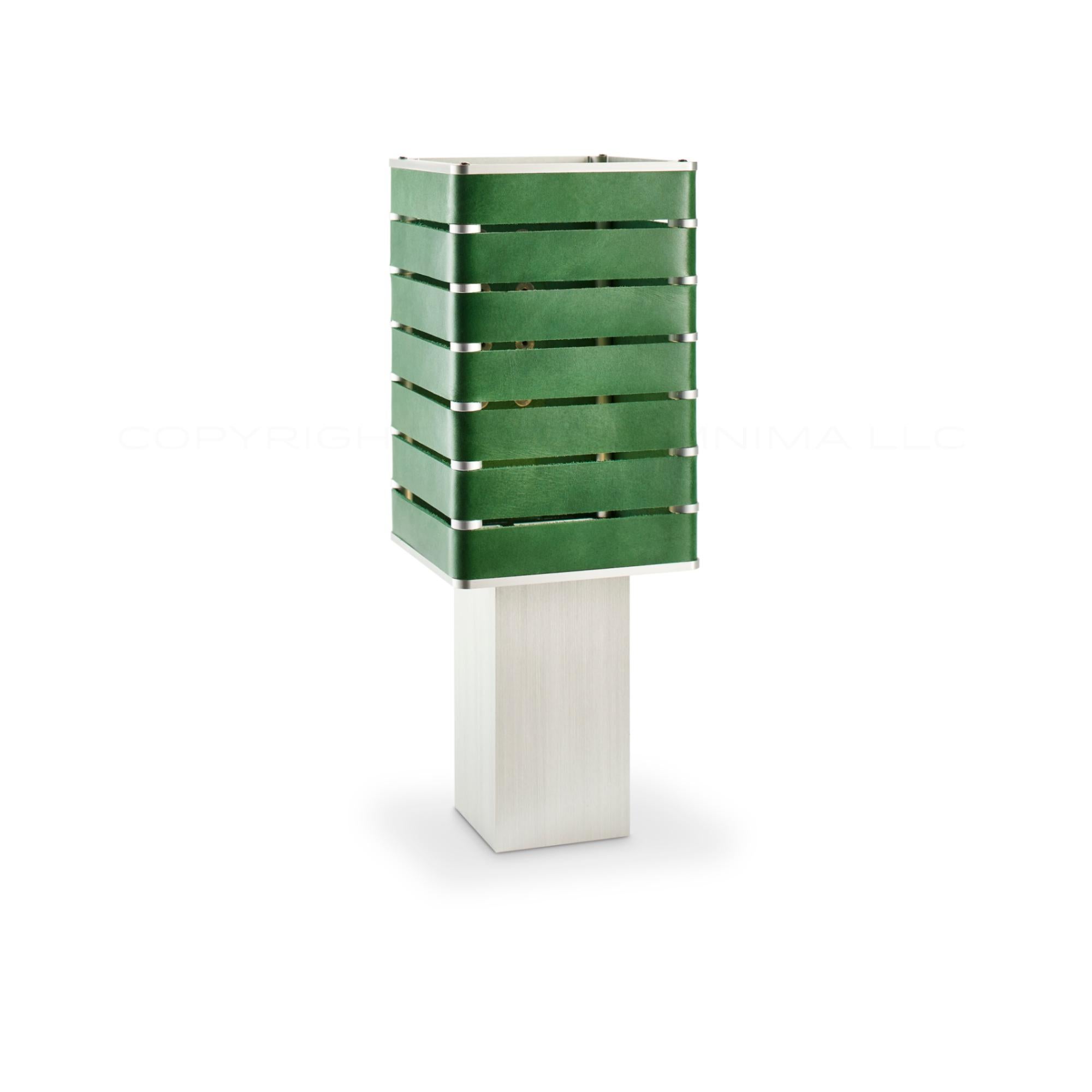 Modern, Minimal, Solid Metal Table Light in Avocado Green Italian Leather with Matte Nickel Snaps.

Introducing Exigen, the customizable lighting platform from mnima.  Presented in an array of crisp, eye-catching colors, Exigen offers maximum