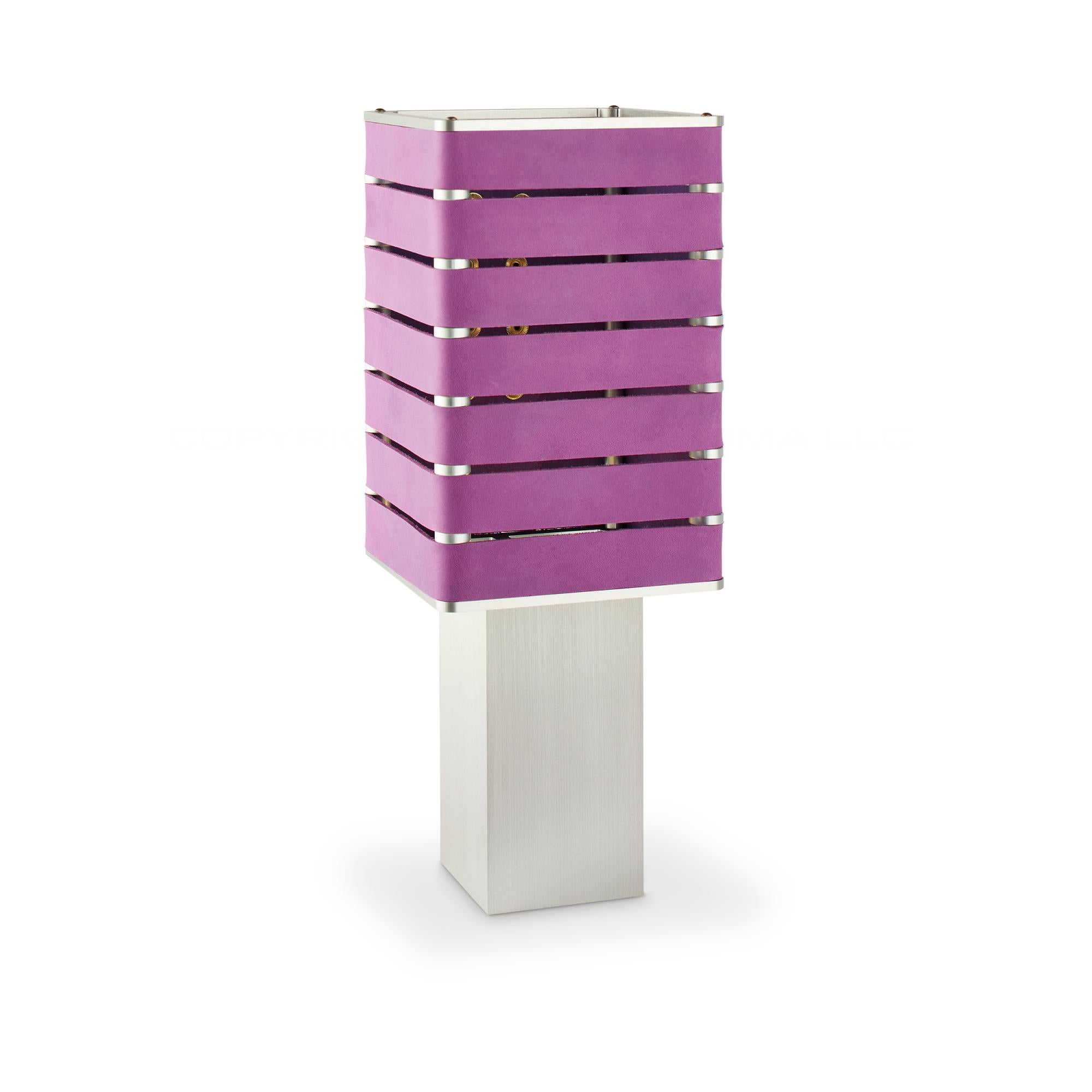 Modern, Minimal, Solid Metal Table Light in Violet Purple Italian Leather with Natural Brass Snaps.

Introducing Exigen, the customizable lighting platform from mnima.  Presented in an array of crisp, eye-catching colors, Exigen offers maximum