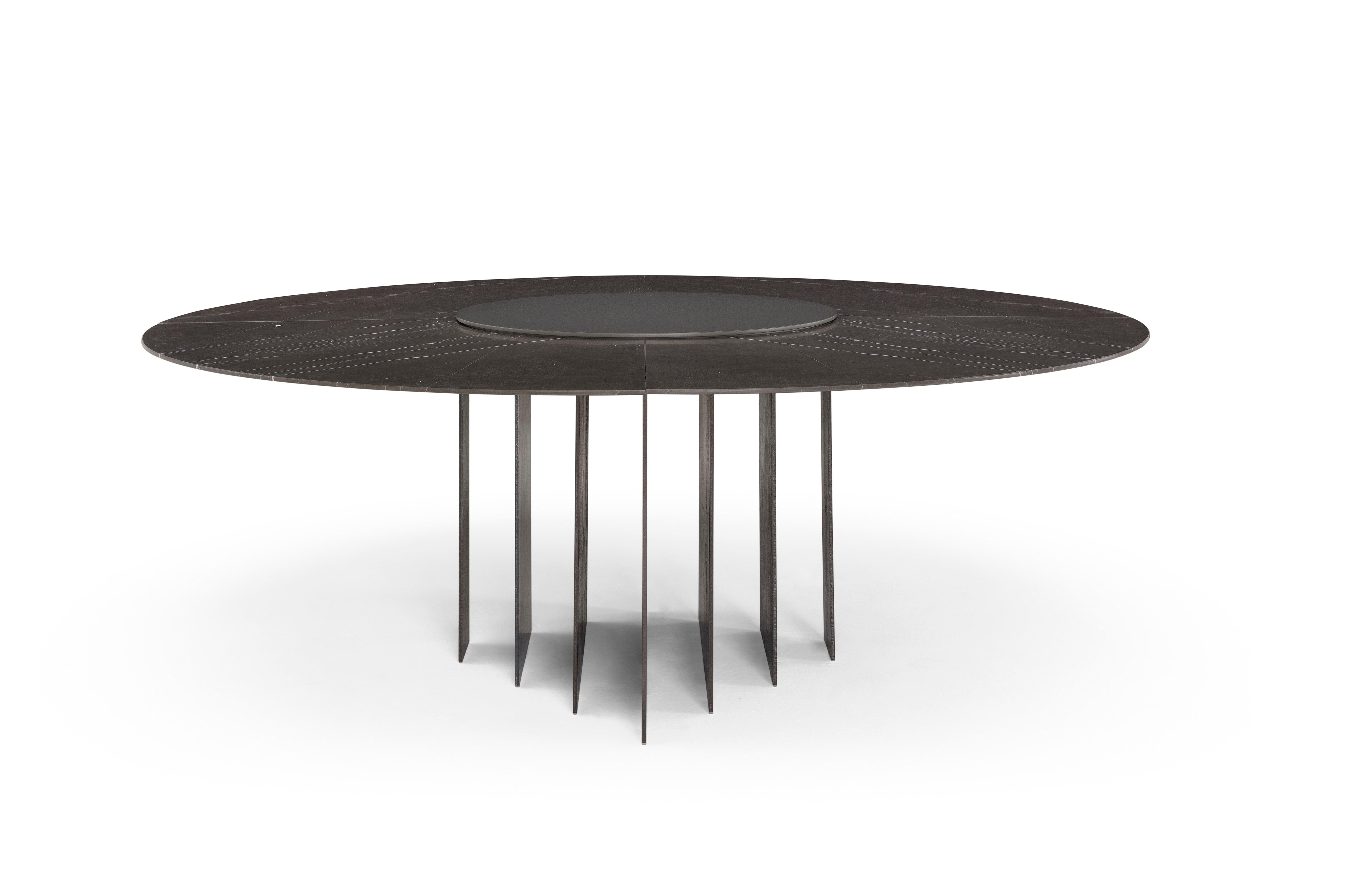 Exilis coffee table with metal feet and black marble top.
     