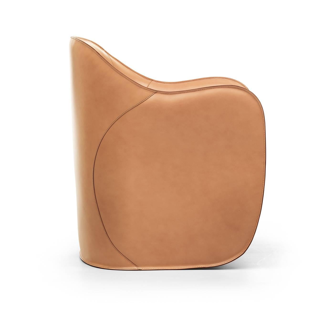 Designed by Alberto Colzani in 2013, this set of armchair and ottoman will add sophistication and a pop of color to a modern living room or study. The polyurethane core creates the sinuous, enveloping shape of the chair, that is mirrored in the