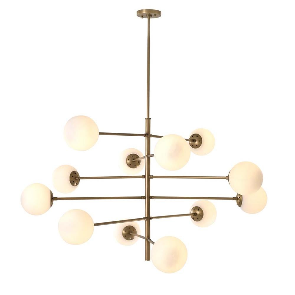 Suspension Exo with structure in solid brass
in vintage finish. With 12 spheres in frosted glass.
With 12 bulbs, lamp holder type E27, max 40 Watts.
Bulbs not included. With adjustable pipe: from 30,
to 50, to 70cm. Also available in UL