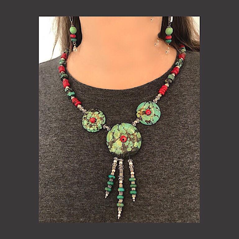 The figured turquoise red coral silver and green turquoise necklace and earring set is my own design. I first created a drawing, then accumulated the materials and assembled them into the piece. I used traditional materials and color combinations to