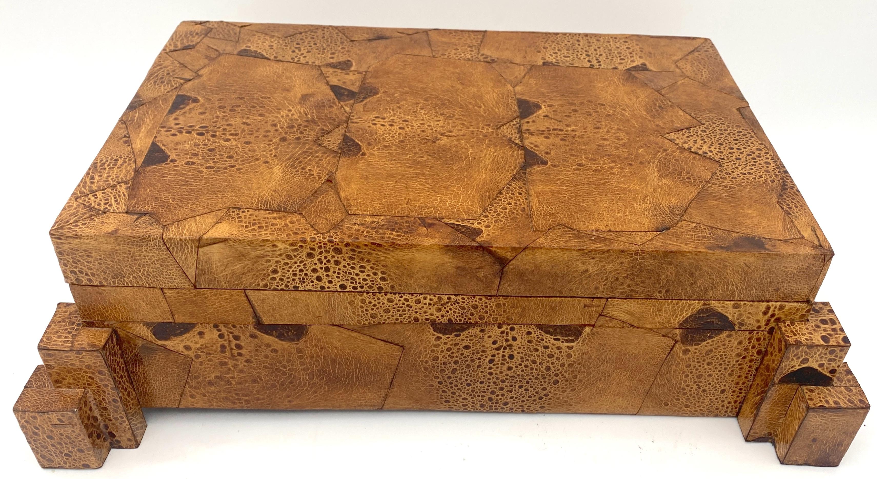 Exotic 1970s Frog Skin-Leather Asymmetrical Table Box, Style of Karl Springer 

A unique box of exotic elegance with this 1970s Frog Skin-Leather Asymmetrical Table Box, in the style of Karl Springer. This piece is a true tour de force, showcasing a