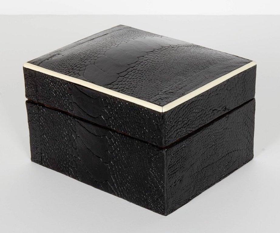 Stunning organic modern decorative box wrapped in exotic ostrich leather with bone inlay trim. All handcrafted in fine leather hand dyed in ebony with palmwood interior. Great storage accessory for a desk, vanity, or coffee table. Box also available