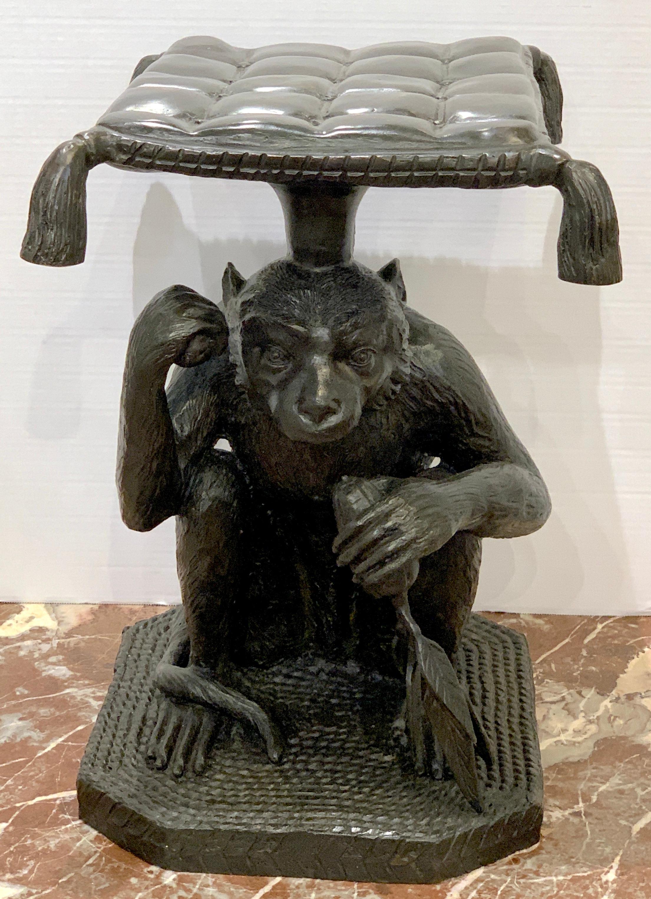 Exotic bronze monkey garden seat, finely cast in one piece with a tasseled cushion measuring 13