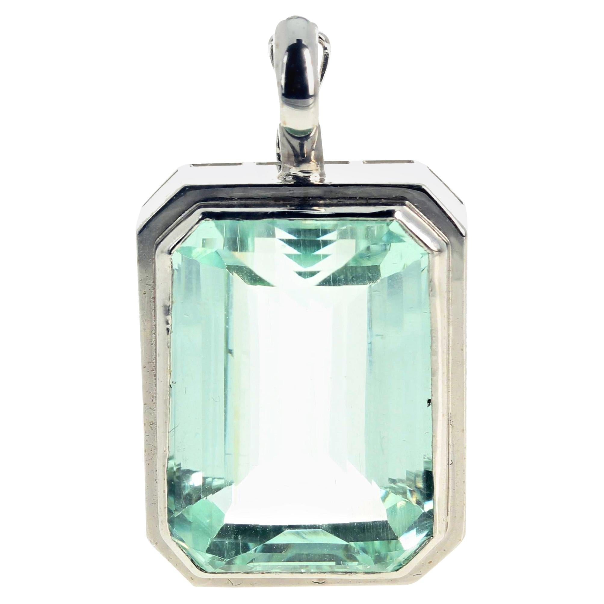 Brilliantly glittering clear (no eye visible inclusions) natural rare 35.5 Carat Hiddenite set in this lovely white gold pendant has a clasp that opens and closes easily so you can hook it onto all different types of necklaces.  This large Hiddenite