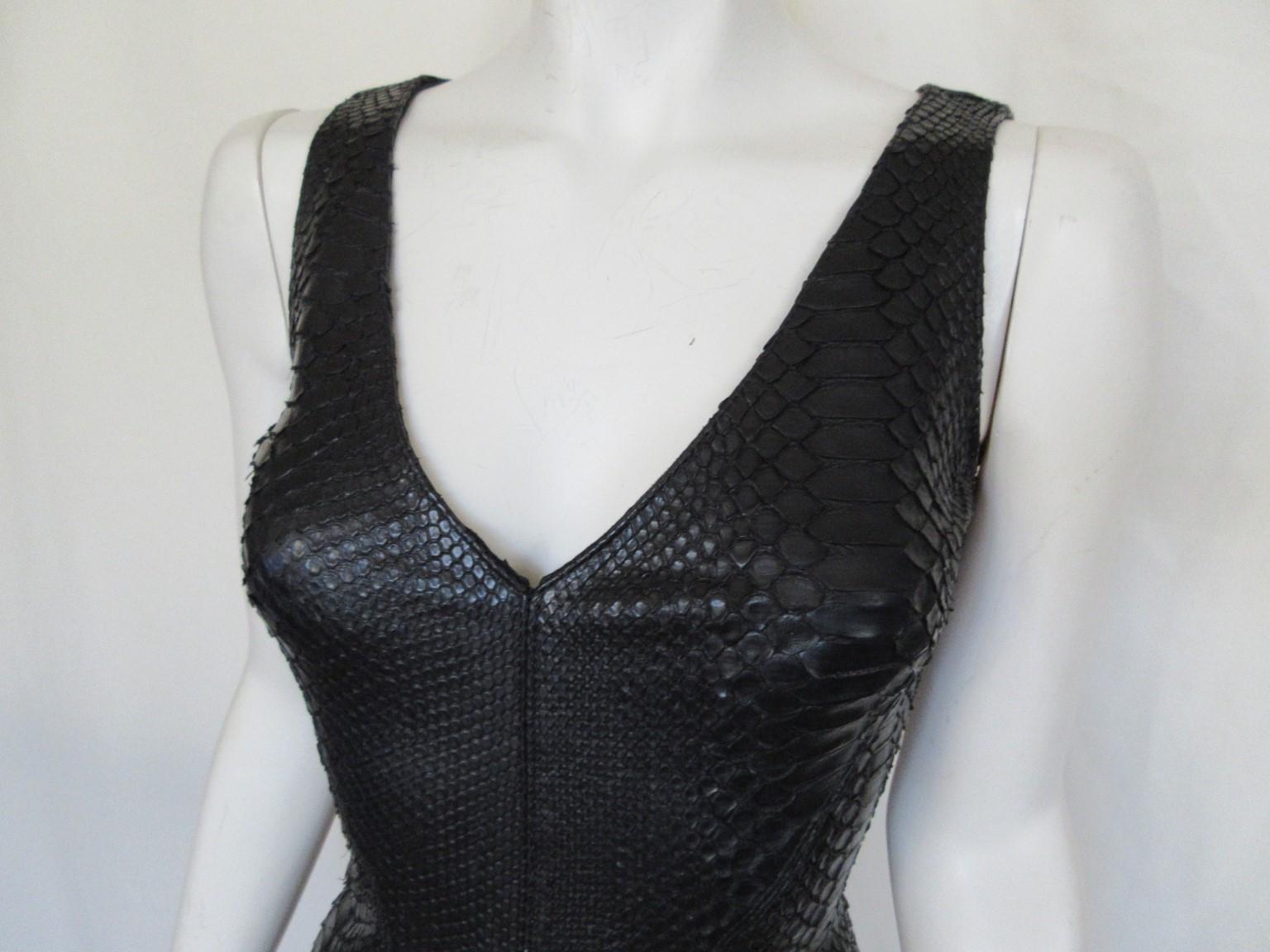 Fabulous unique dress in black color 100% pithon leather from Aphero

We offer more exclusive exotic leather and fur items, view our frontstore

Details:
Back zipperclosure
Stretch
no lining
Very rare to find 
Size fits as small US 6, see section