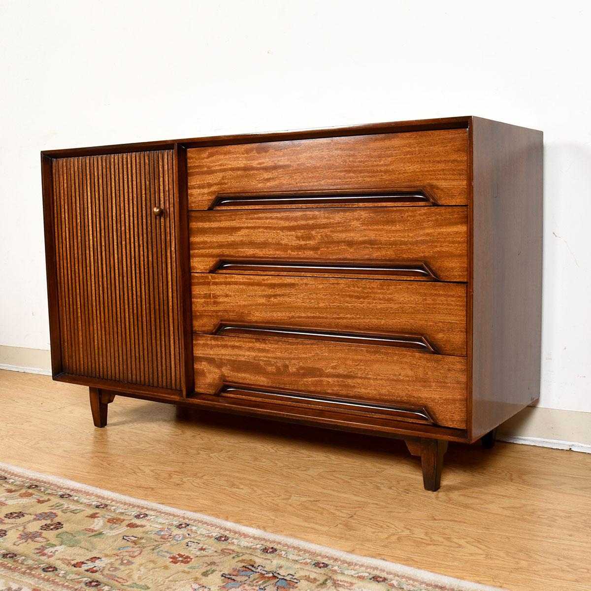 Exotic Mindoro Wood Cabinet by Milo Baughman for Drexel Perspective, 1951

Additional Information:
Material: Wood
Featured at Kensington:
Four drawers, each having a sculpted pull along the bottom edge outlined in darker wood
Door on the left