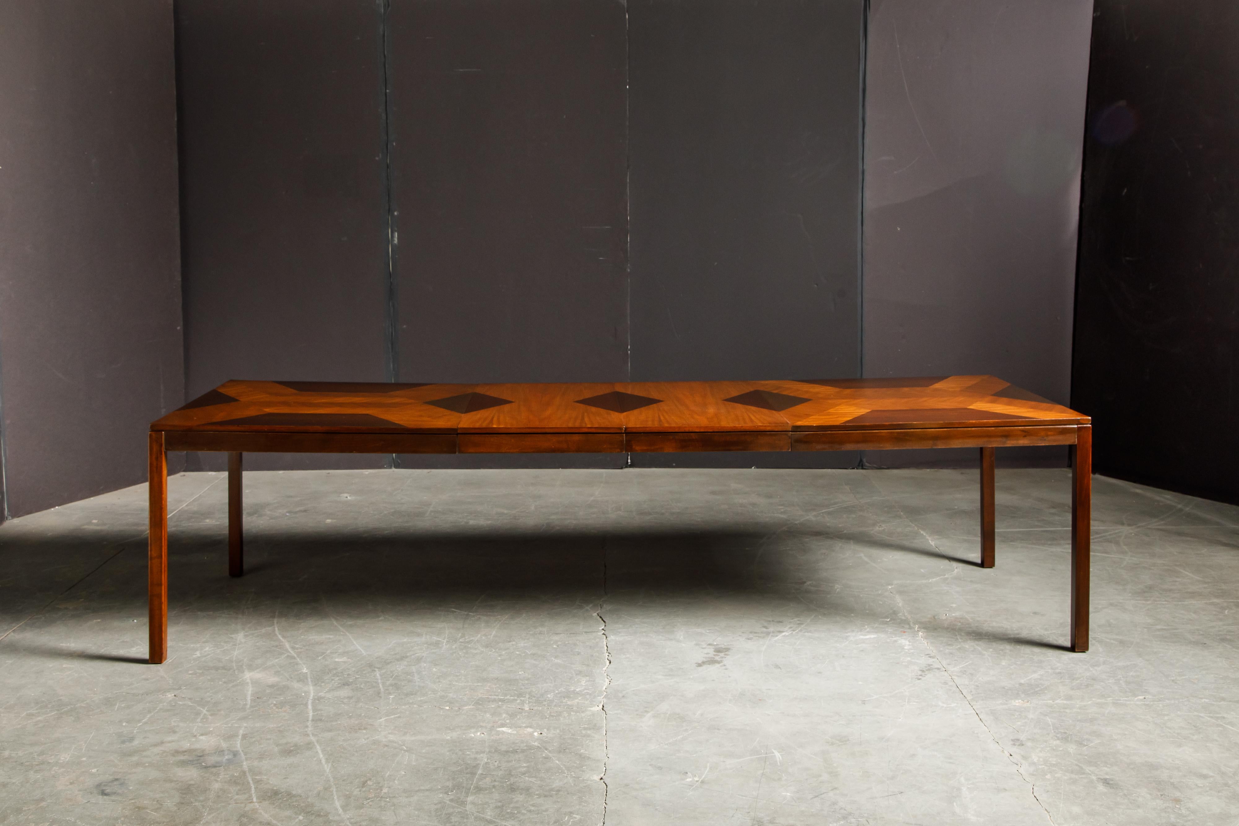 This beautifully refinished 1970's Parsons dining table by Milo Baughman for Directional features strips of highly grained exotic woods in various finishes and patterns creating contrasting lines and shaped for a spectacular effect. 

In excellent