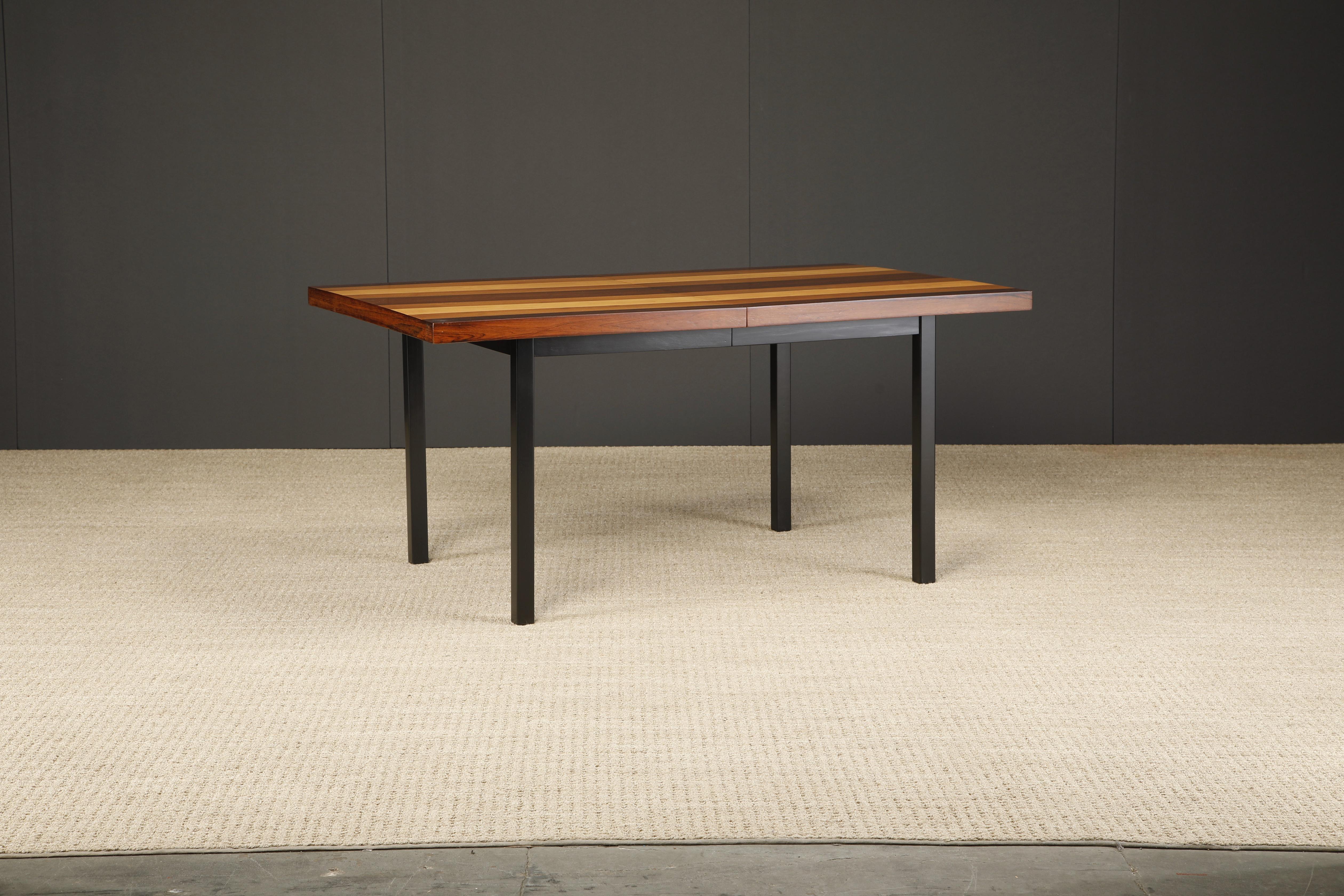 This beautifully refinished exotic wood inlay 1960's California Modern dining table by Milo Baughman for Directional features highly grained exotic woods creating contrasting lines shaped for a spectacular effect. In excellent refinished condition,