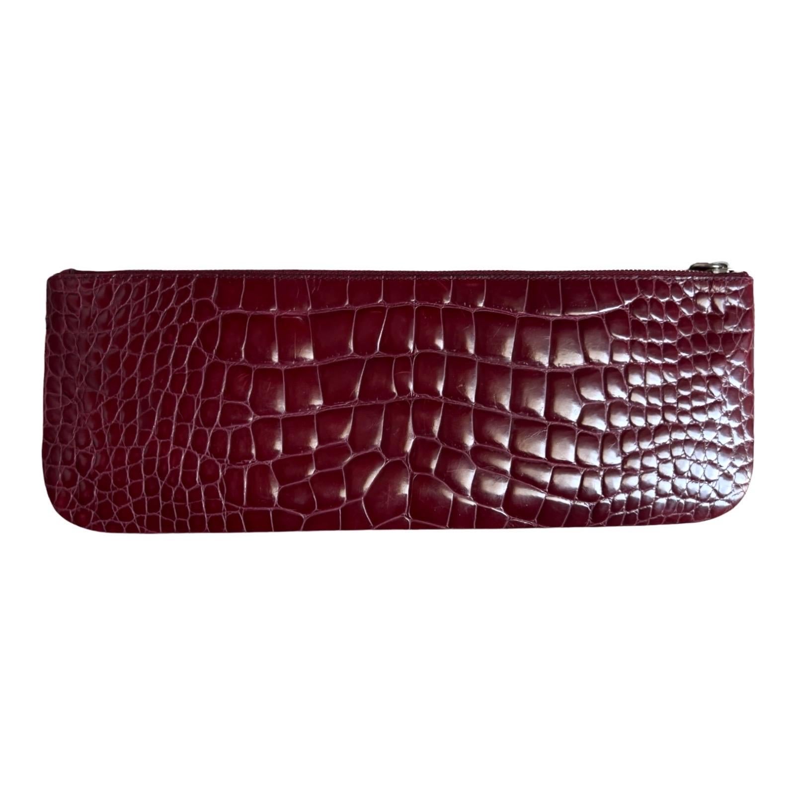 A PRADA signature piece that will last you for many years
Timeless classic - a true beauty!
A truly luxurious and elegant piece

Prada long clutch with silver-tone hardware
Logo adornment at front
Wonderful shiny exotic-print leather
Tonal satin