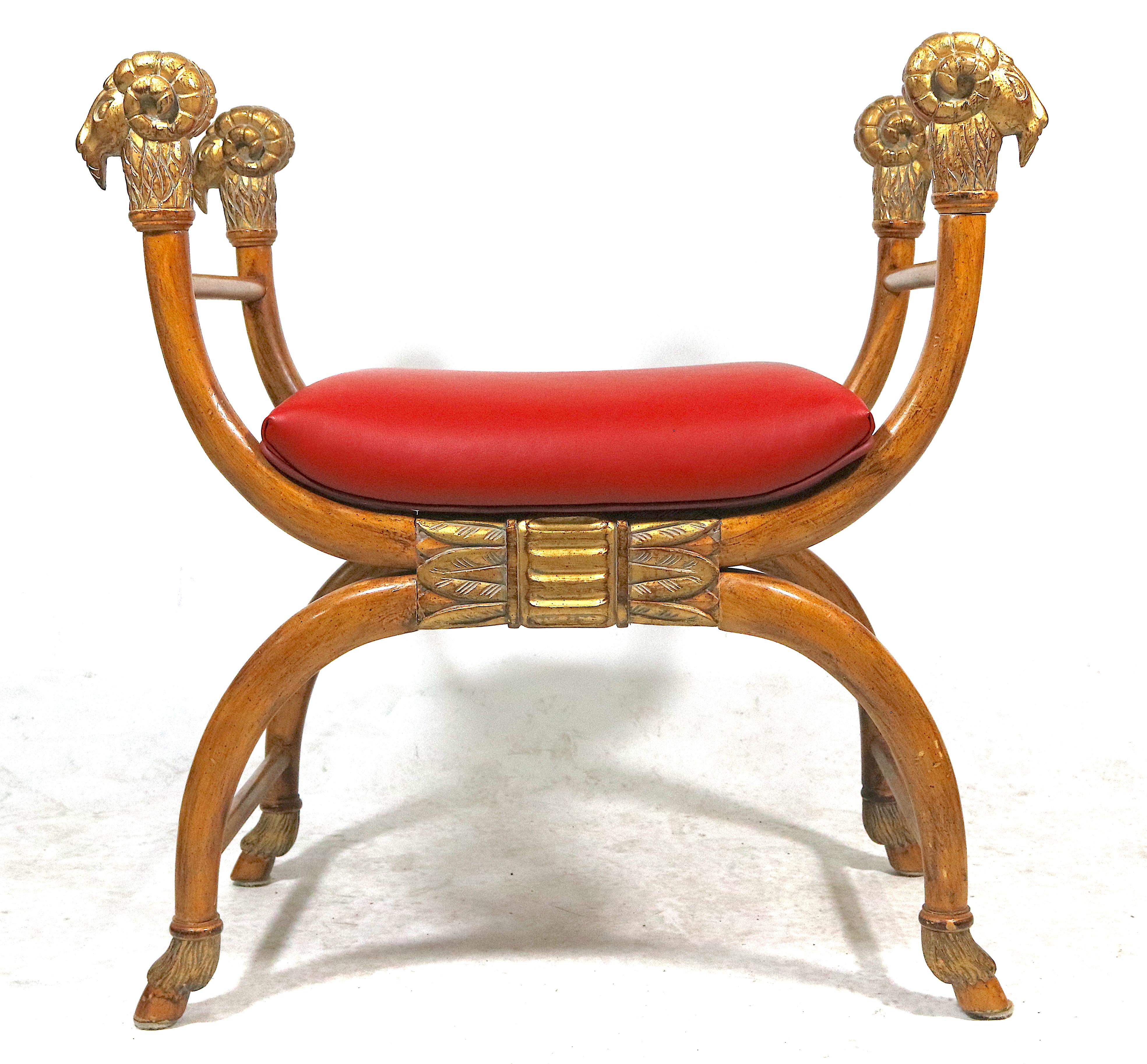 Haute style light wood bench with gilt carved curved arms ending in nicely detailed ram's head, Egyptian design carved centre apron, the curved legs terminate in 
Carved Hoof Feet.
Exotic Egyptian revival, grand scale bench. Mid-20th century
New