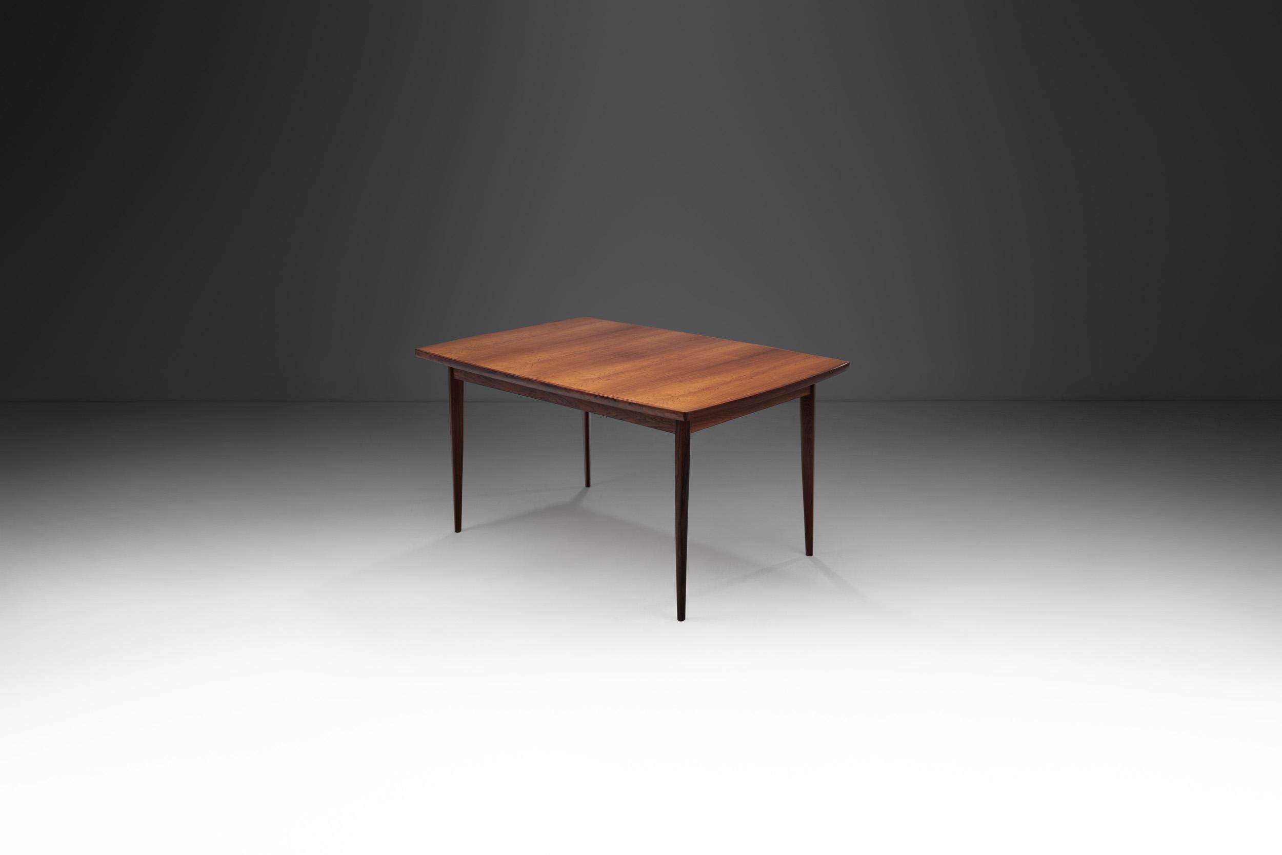 This gorgeous extendable dining table model by the Danish furniture maker, Bernhard Pedersen og Søn was inspired by classic Danish furniture design and simplicity. The period between 1950 and 1970 in particular was characterized by some of the most