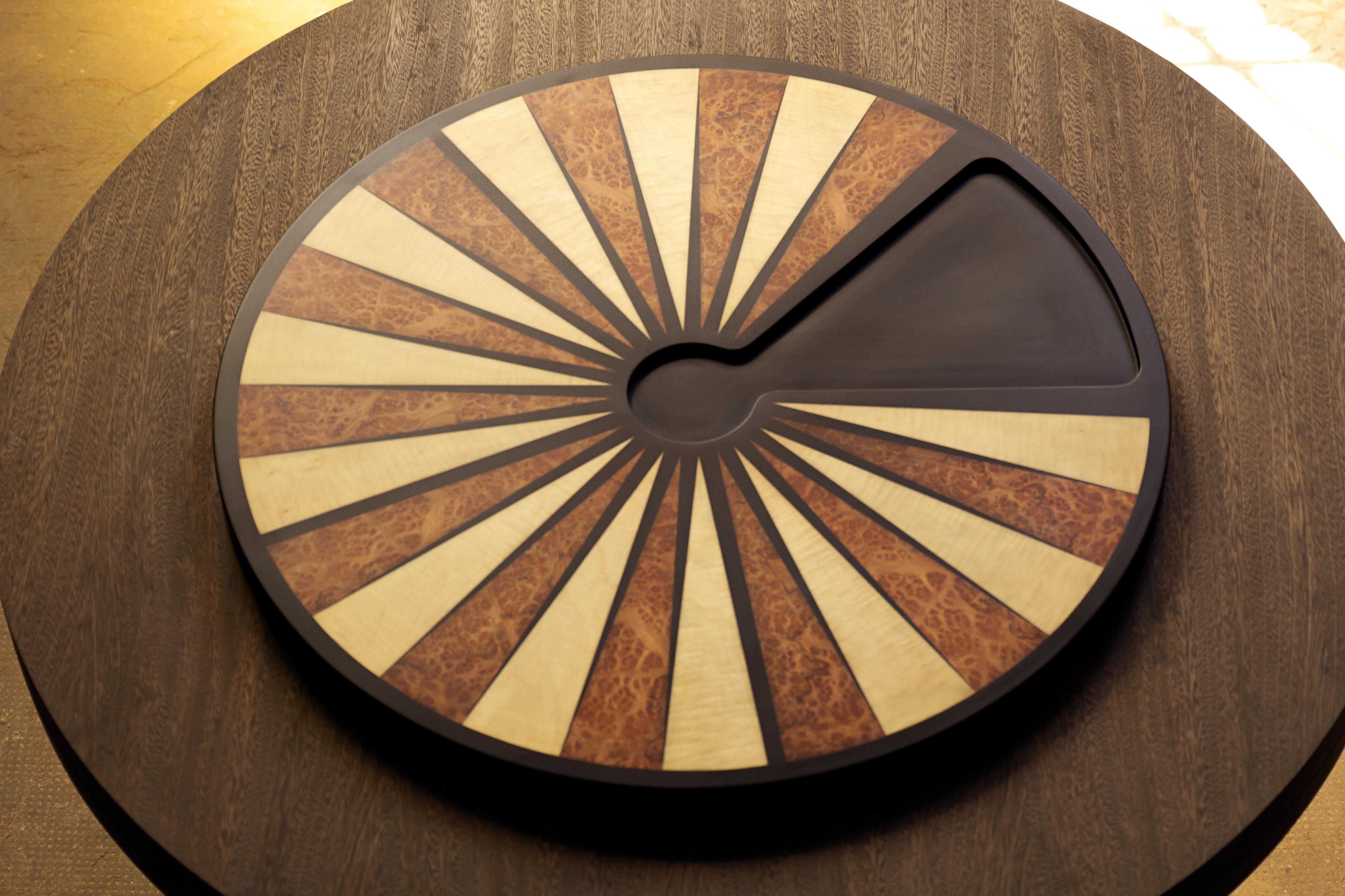 This unique table marks our second foray into tables that double as a functioning backgammon table in the round with a recessed area for dice, our first being a collaboration with the Bergdorf Goodman's men's store. 

This piece features an