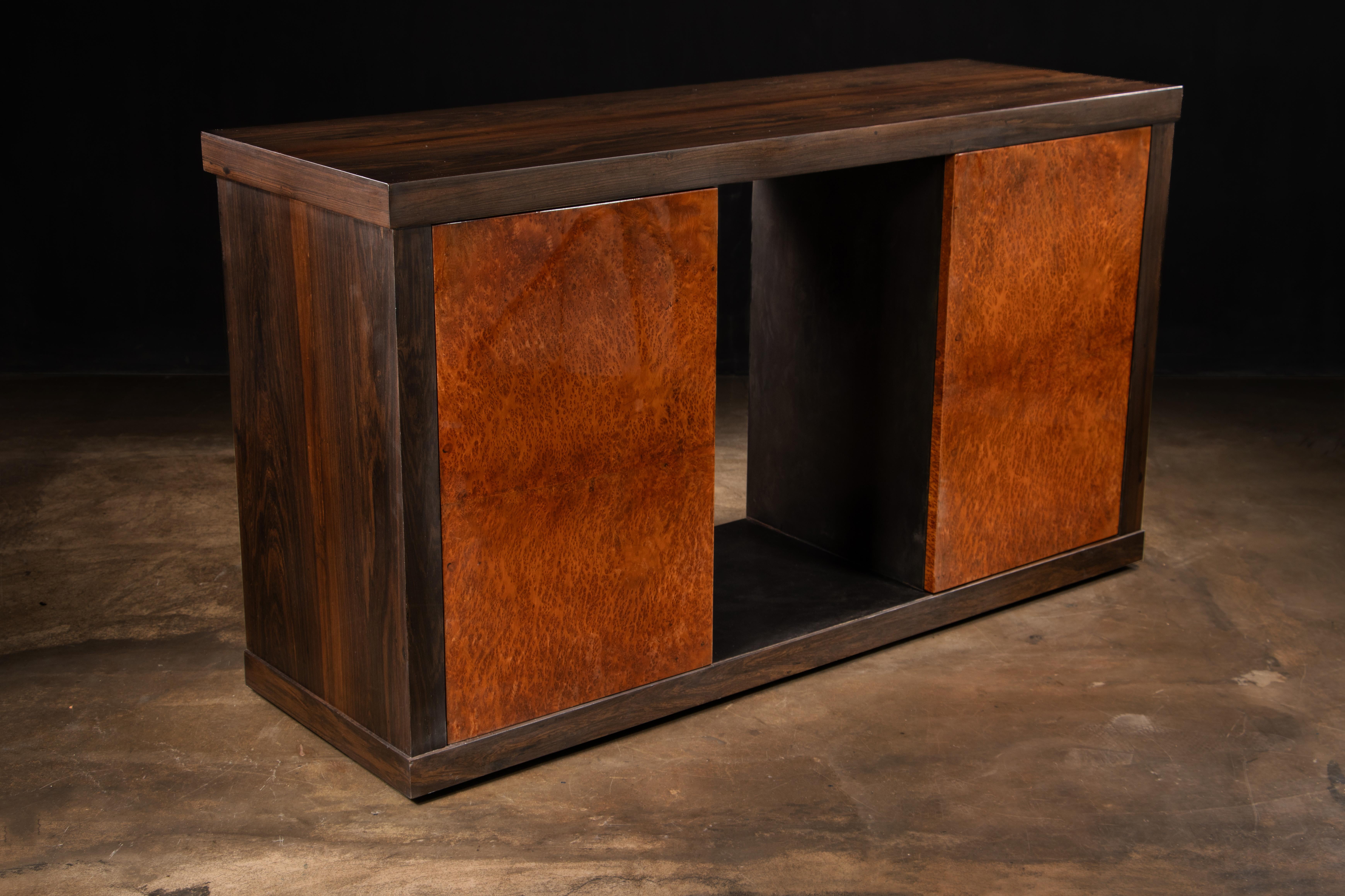 The Bertolucci Exotic Wood and Oil Rubbed Bronze Sideboard (2 doors) from Costantini Design features high gloss Vavona Burl doors, a dark walnut frame, and oil rubbed bronze inlays.  Available as shown or in the finish, wood species and size of your