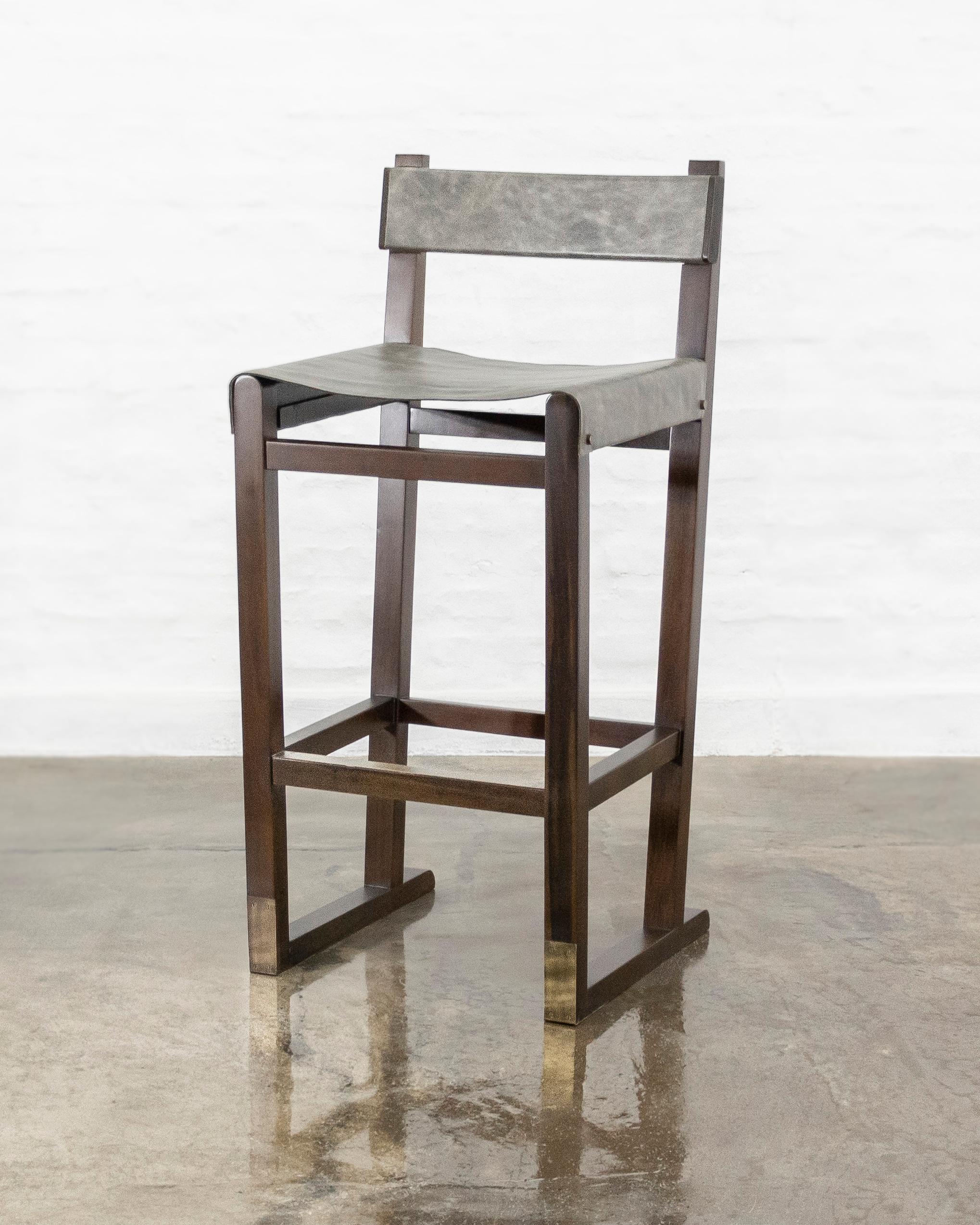 Costantini prides itself in using the hardest and most beautiful hardwoods in the construction of its line of seating. The Piero Bar Stool features a solid Argentine Rosewood frame with a slung leather seat, a leather-wrapped wood back, and a