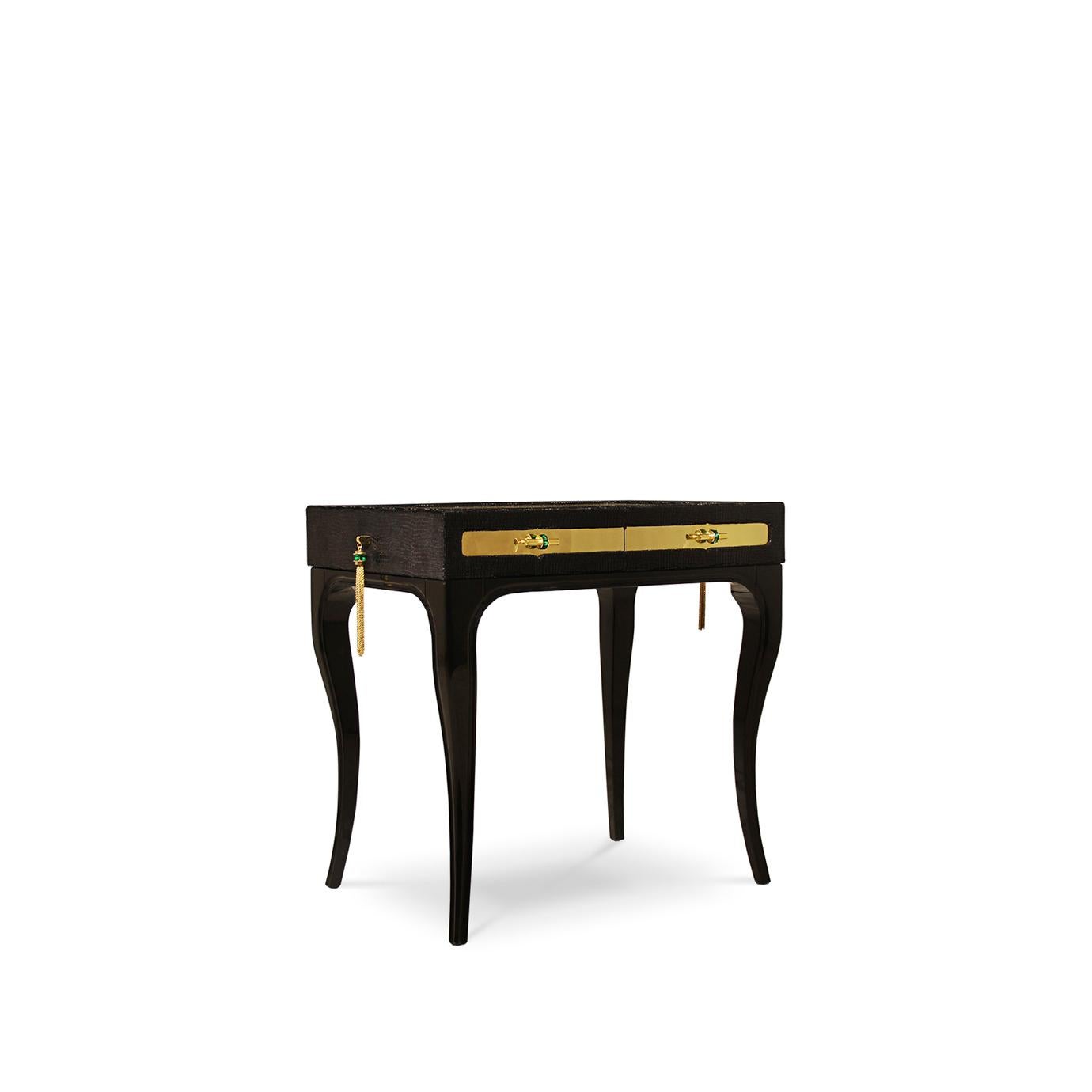 Exuding feelings of fantasy, this highly coveted nightstand is bold, daring and seductive. Her wooden frame is cloaked in an exotic fabric with a complementing metal top, juxtaposed with the mesmerizing movements of shimmering glass tassels.
