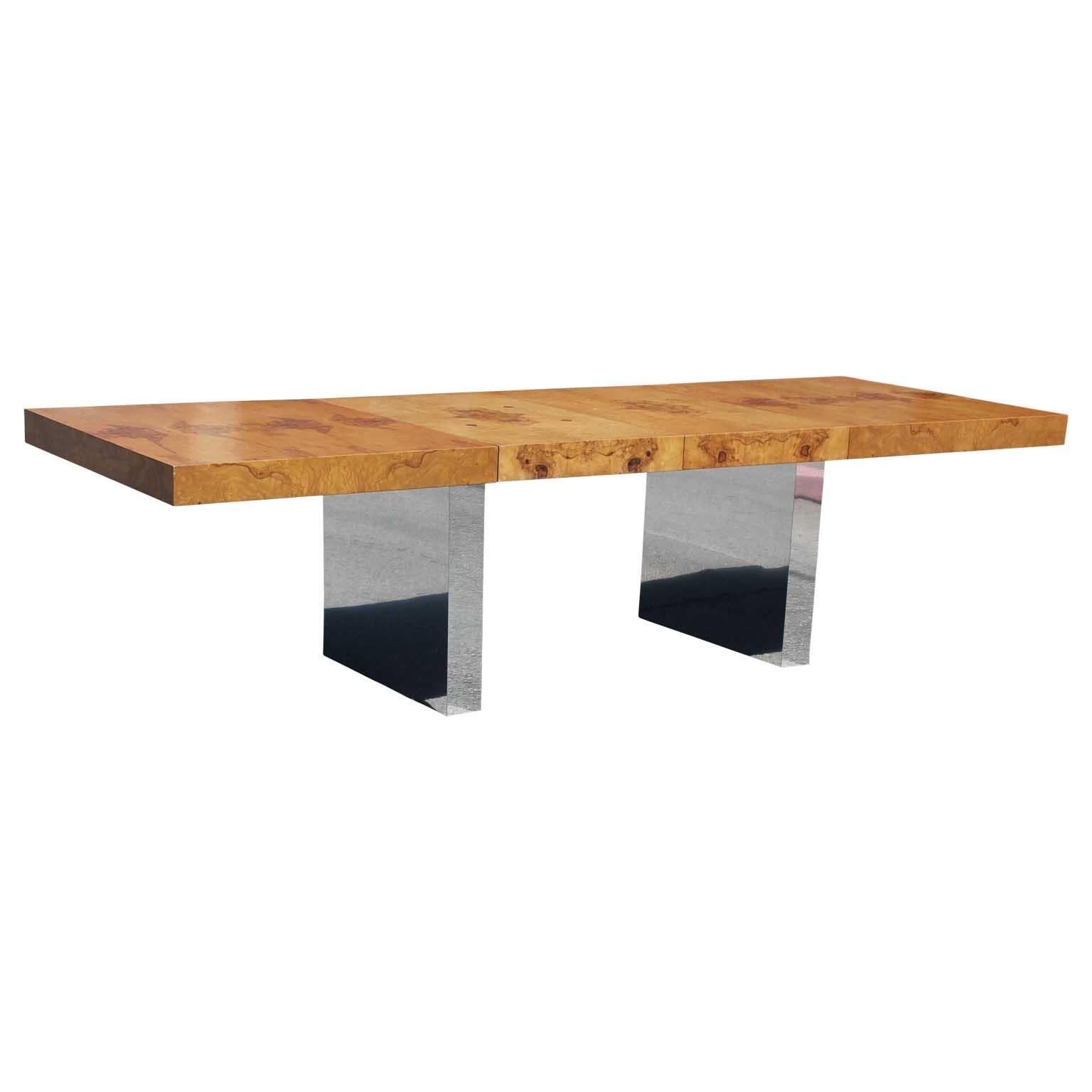 Sturdy expandable dining table by Milo Baughman for Thayer Coggin. Modern design with beautiful burl wood and chrome legs. 
This table has two removable leaves each measuring 22 inches wide for an additional 44 inches in total. Width without leaves