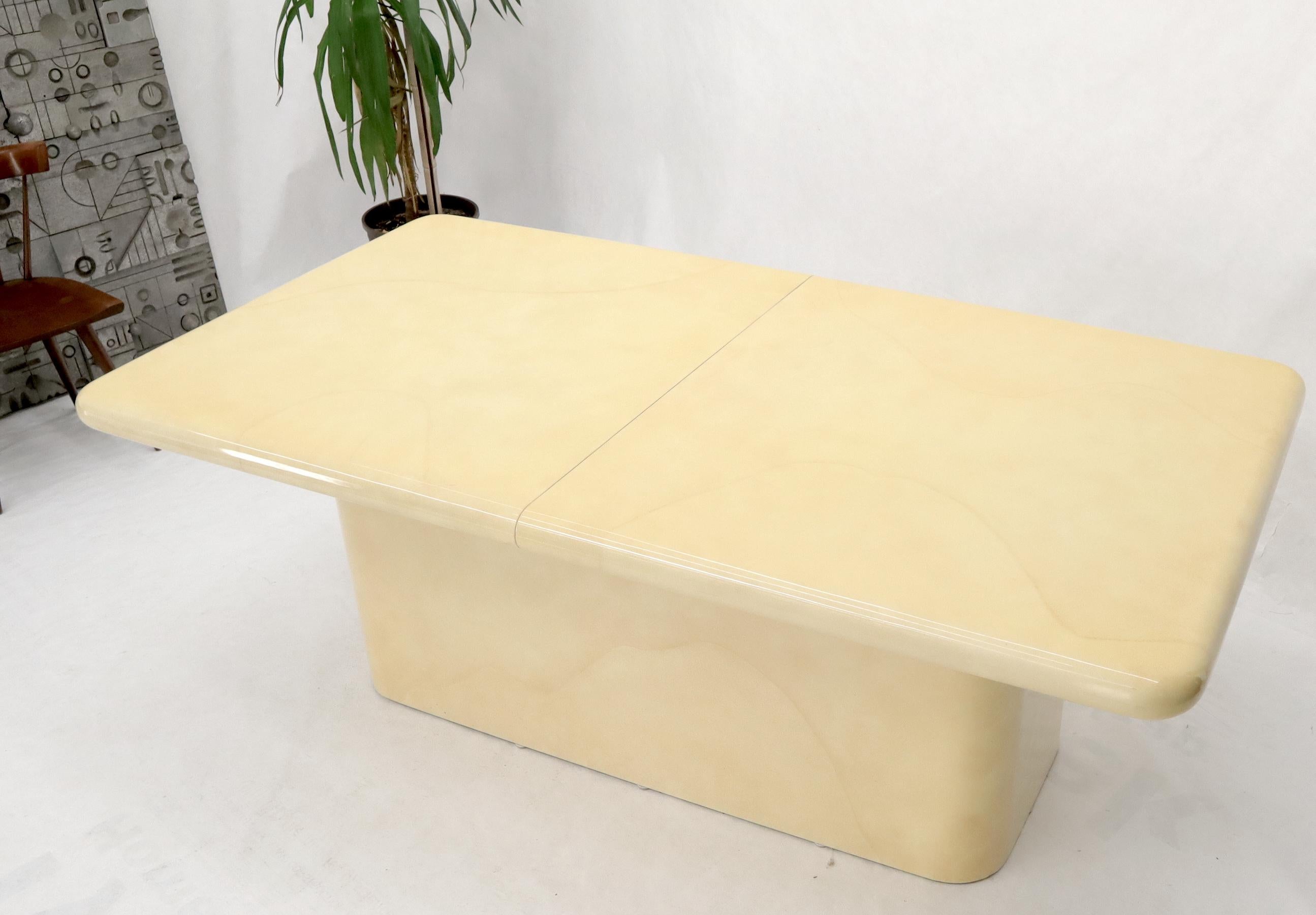 Mid-Century Modern lacquered faux goat skin dining table with 3 x 16
