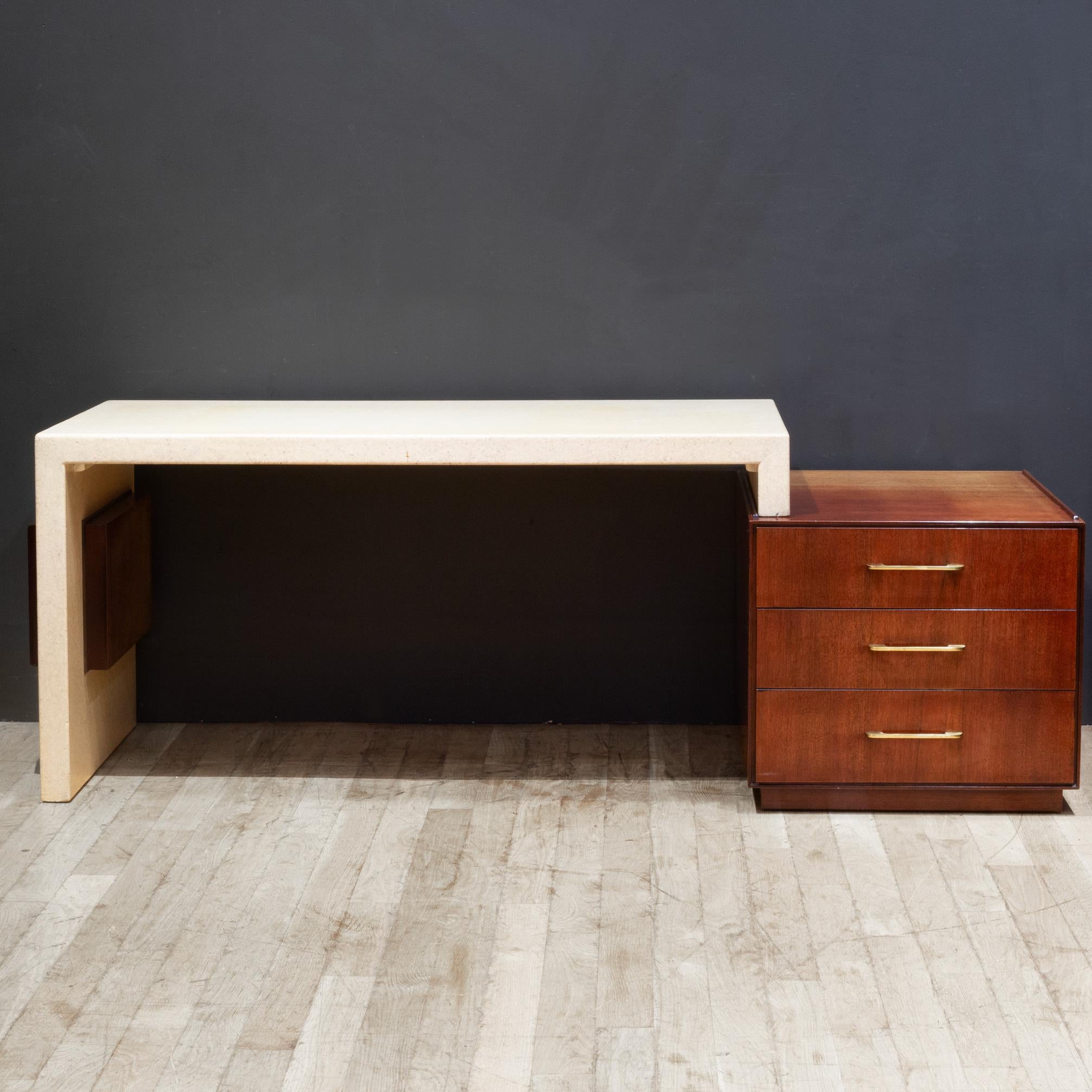 ABOUT

An original expandable Paul Frankl desk with cork surface and a Mahogany base with brass hardware. Three drawers, open storage compartment on opposite side and Mahogany bookshelf on the side. Marked underneath and maker's mark in interior