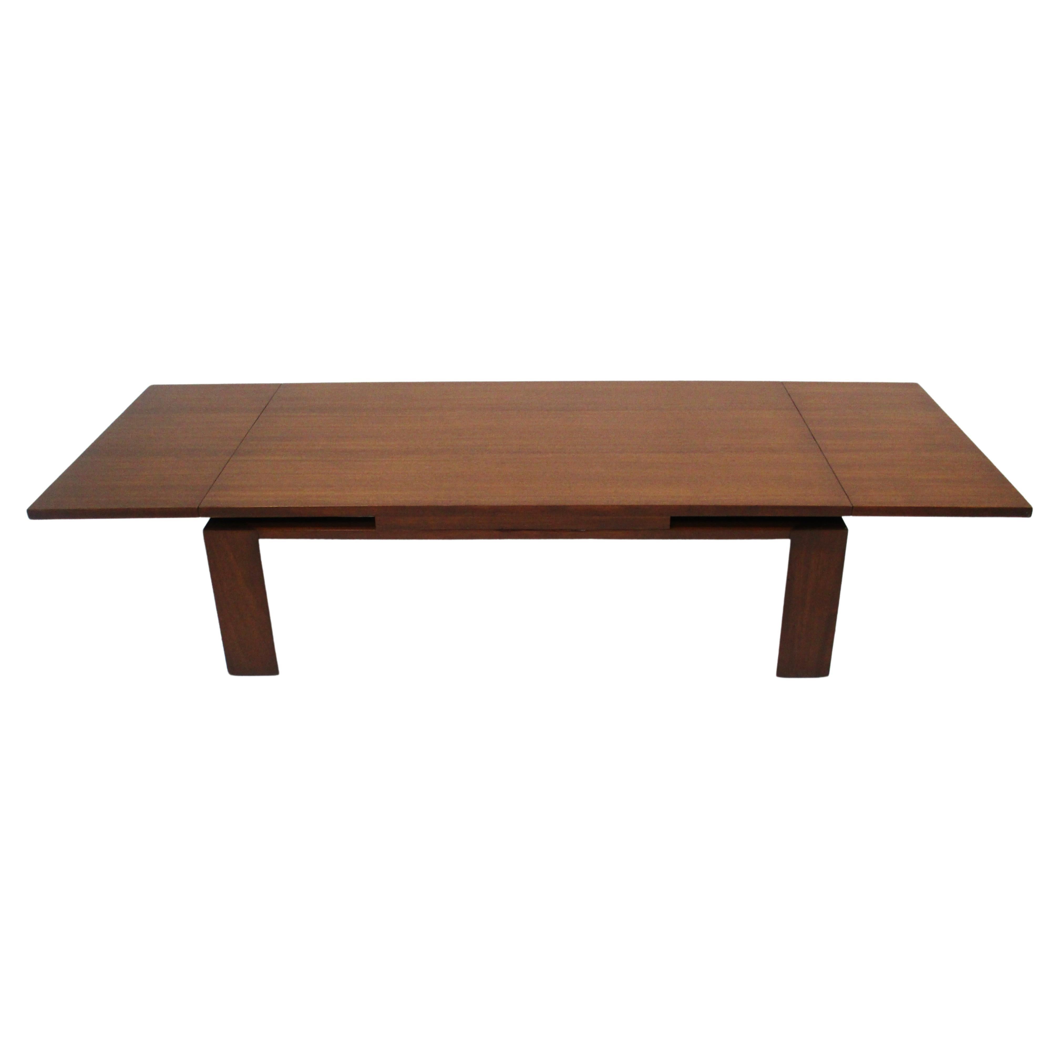 A very well crafted mahogany expanding refectory coffee table with each end that pulls out making the total length 68
