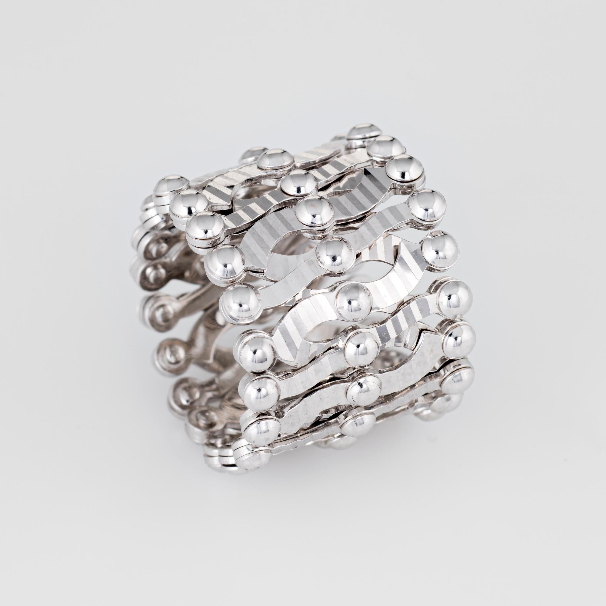 Stylish estate expandable ring to bracelet crafted in 14 karat white gold. 

The ingenious design allows the ring to expand and contract to fit just about any size finger and wrist. The textured lattice work design allows for endless accessorizing