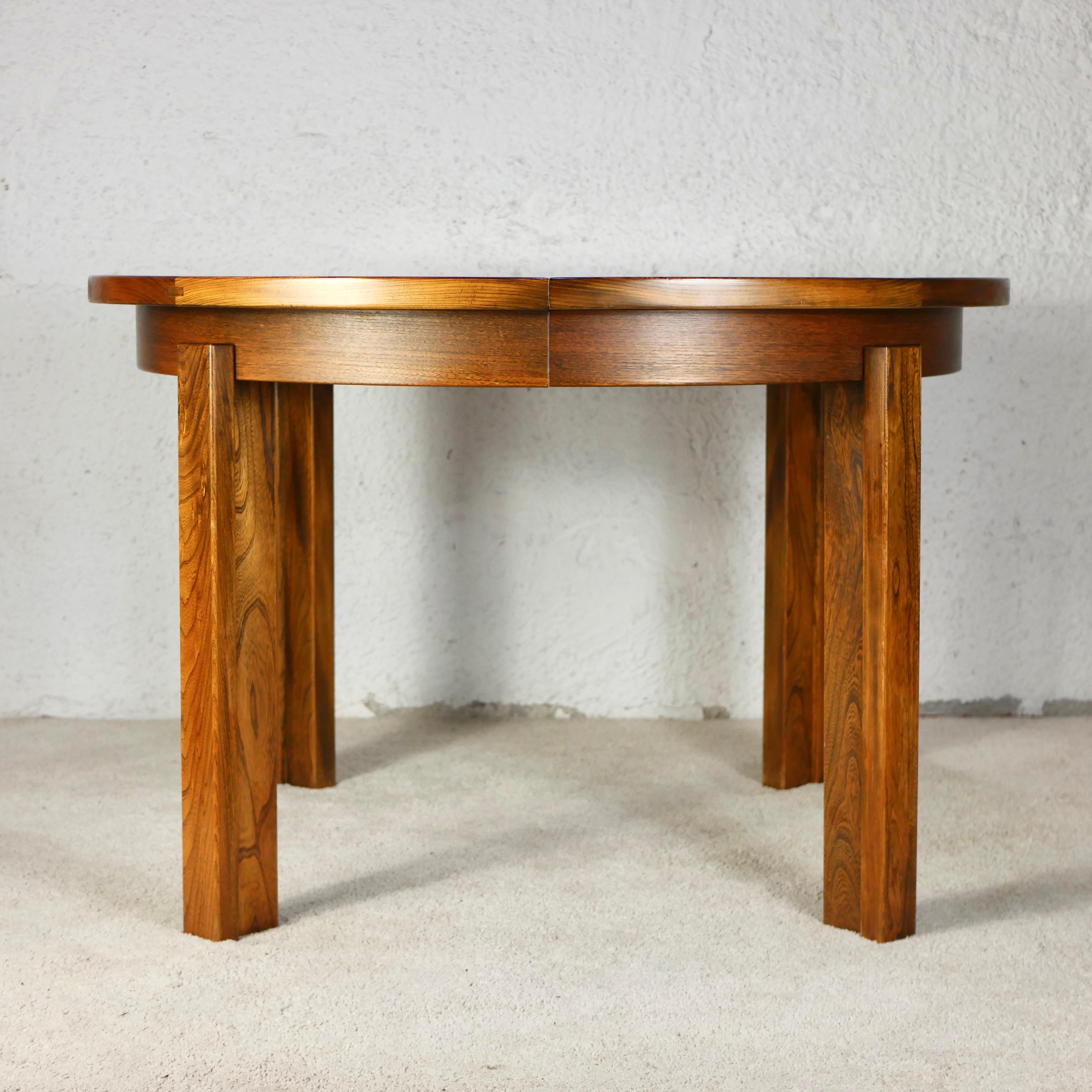 Beautiful solid elm table made by Maison Regain in France during the late 1970s.
It has two extensions, and goes from 115cm width to 203cm, for 4-8 people.
Nice wood grain and patina, beautiful making details, very sturdy and practical.
Very good