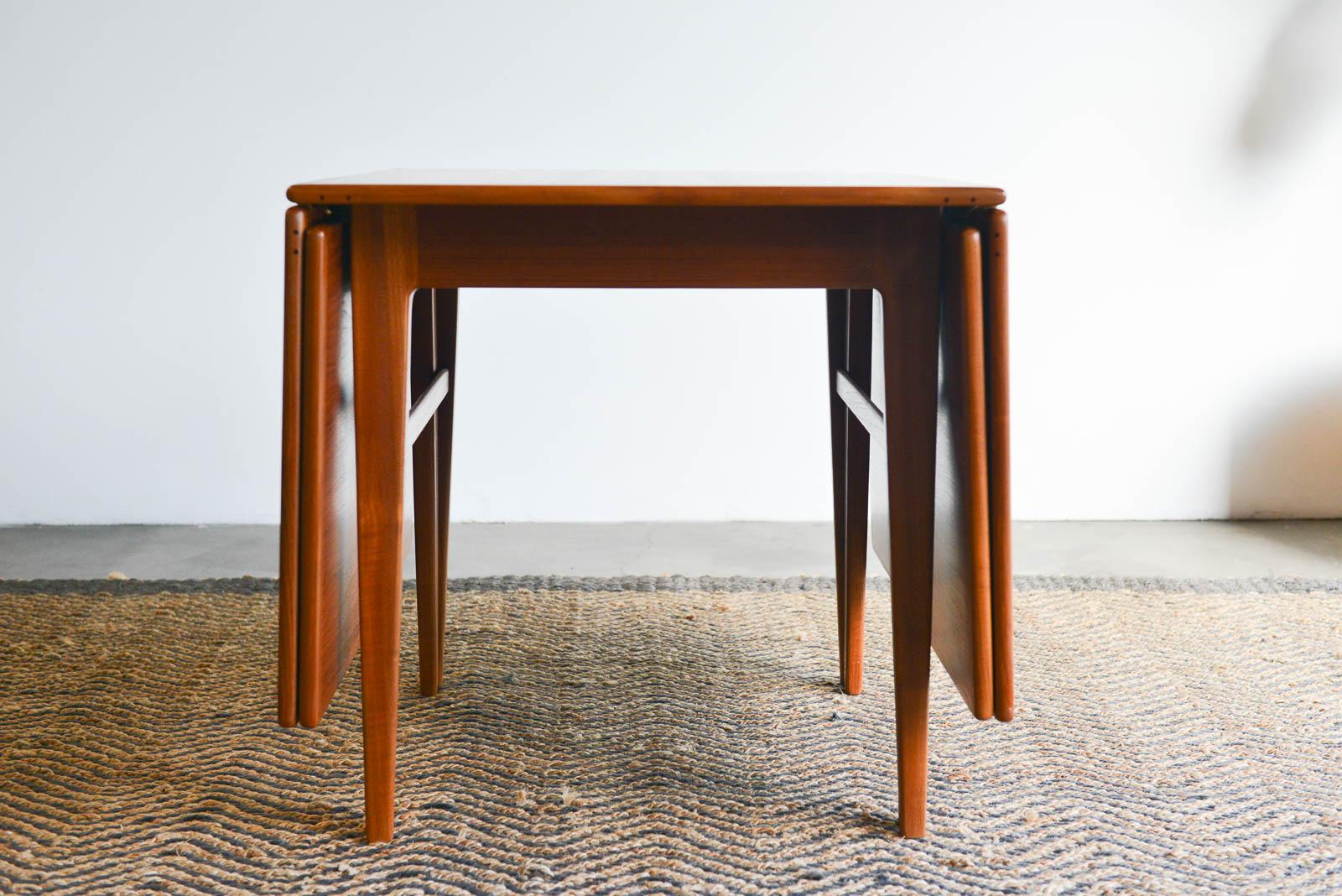 Expandable teak dining table by Erik Worts, Denmark, circa 1960. Erik Worts was a master cabinetmaker who sold his pieces through Den Permanente in Copenhagen. Den was a collective of artisans who sold handcrafted pieces to the public. This table is