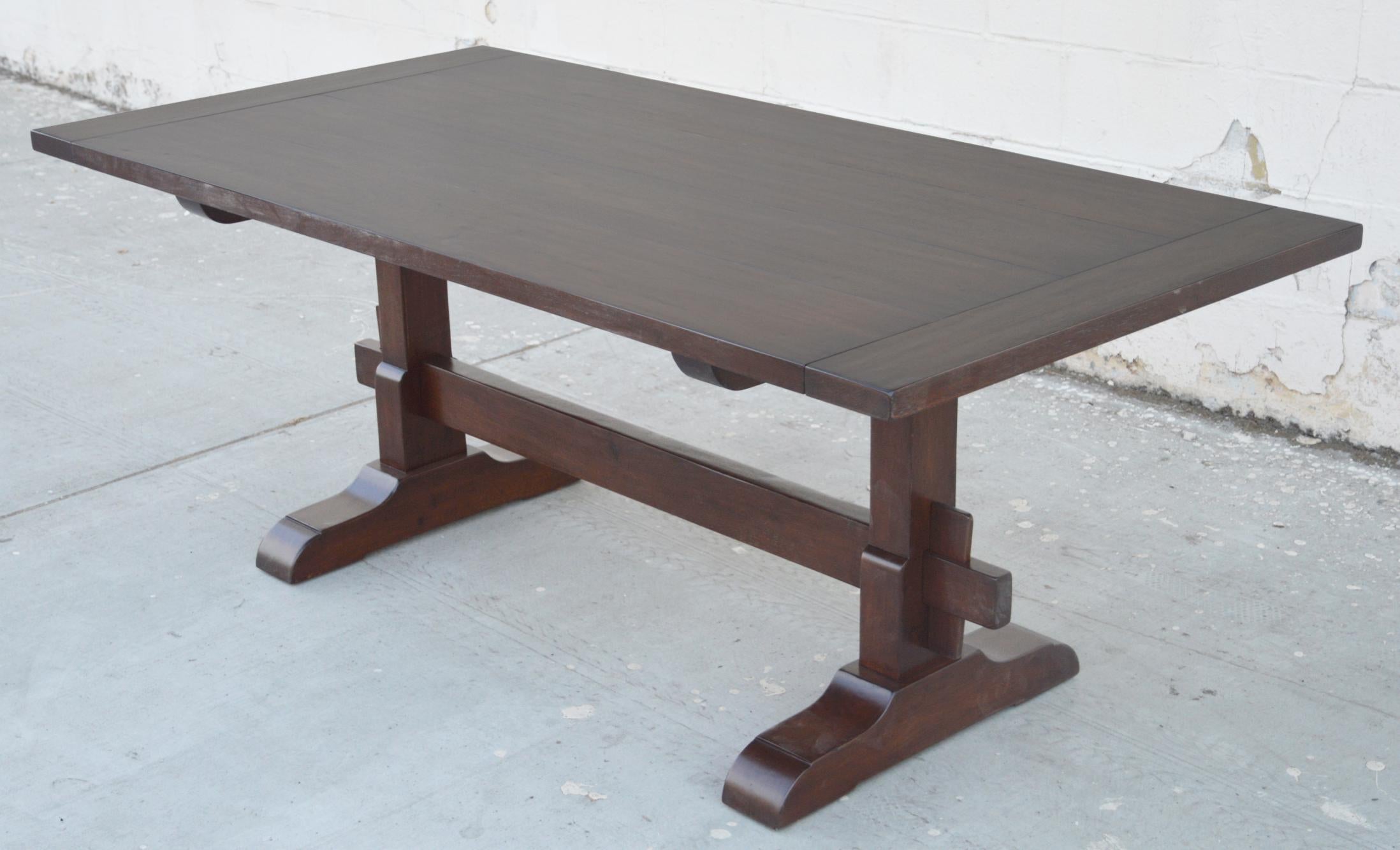 This walnut trestle table is seen here in 90
