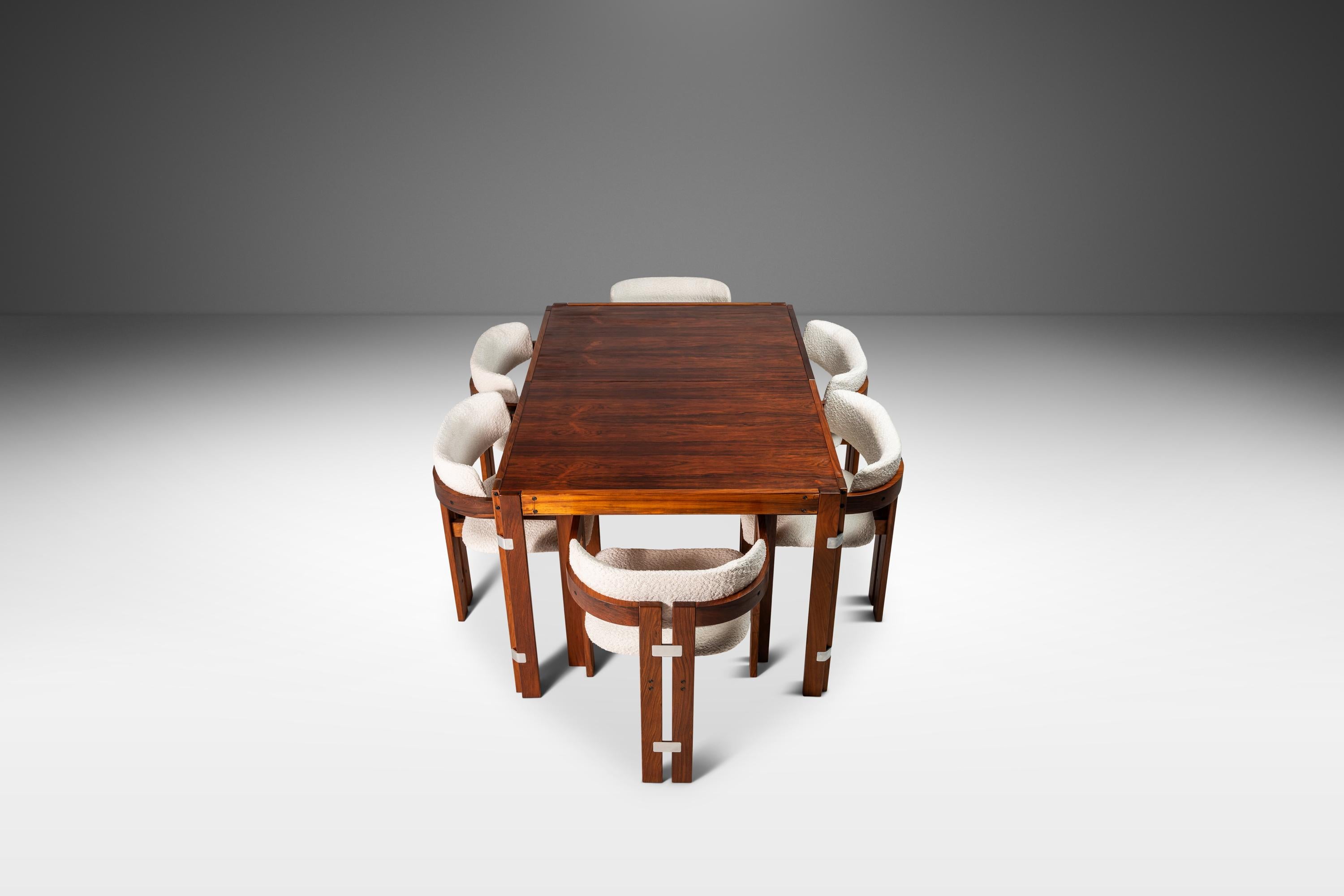 As functional as it is aesthetically breathtaking this extraordinary expansion dining table, constructed from Brazilian Rosewood, is in 100% original, vintage condition. Featuring a single expansion leaf that conveniently stows in the table,