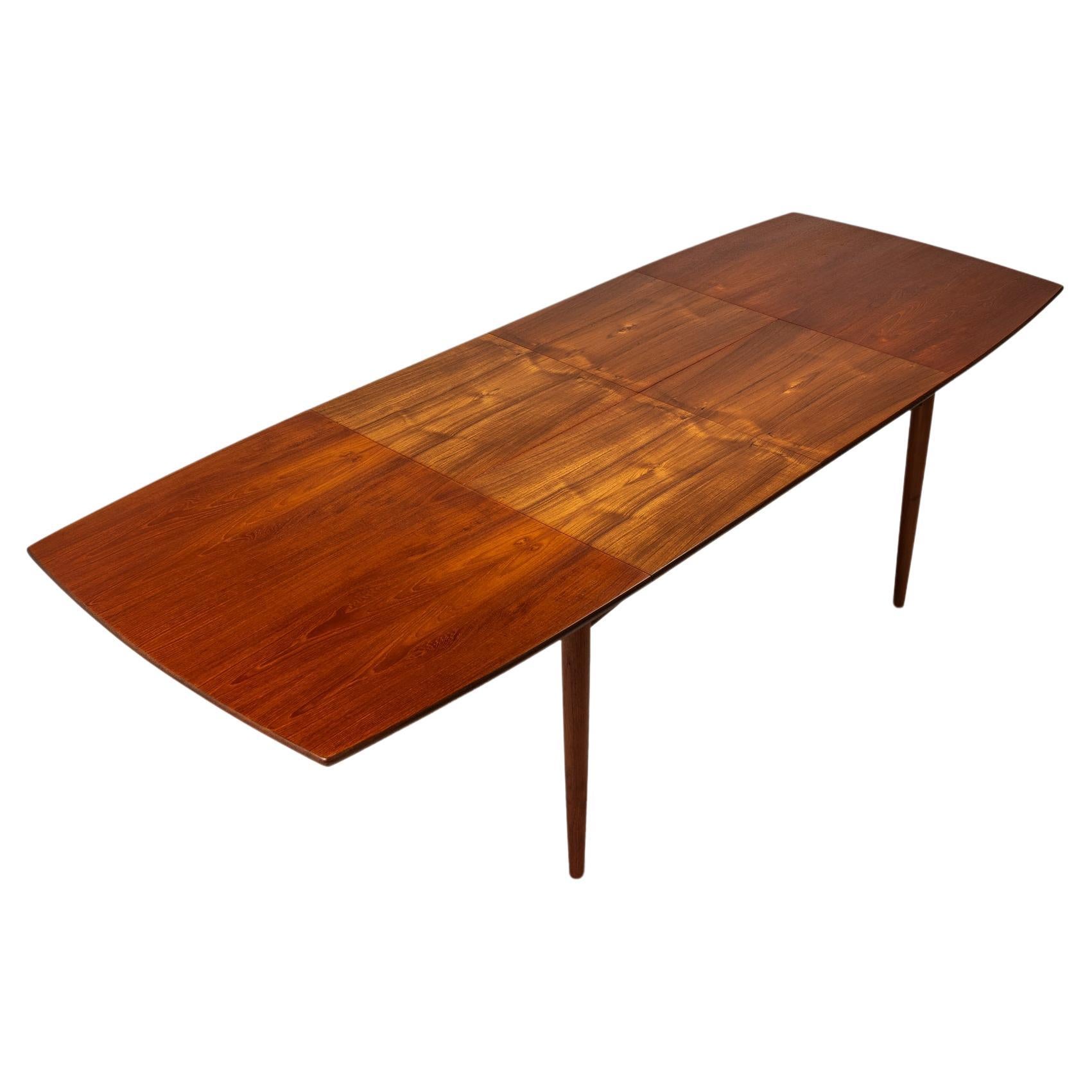 What is a butterfly leaf in a dining table?