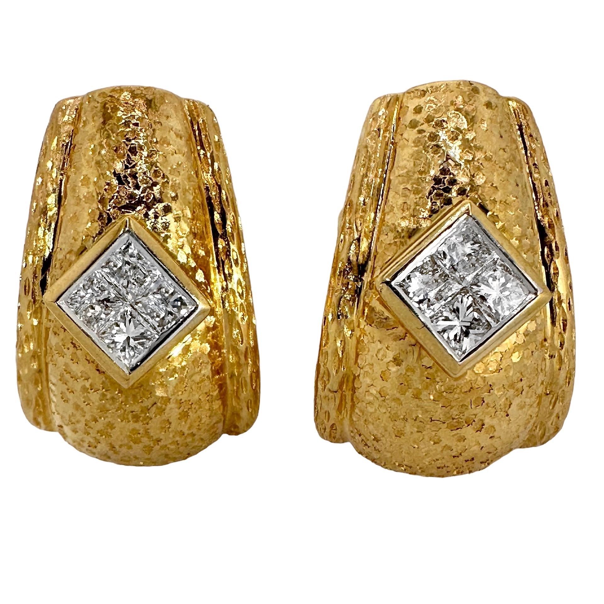 This expertly hammered and Bark finish pair of Late-20th Century 18k yellow gold j-hoop earrings are as well crafted  as they are striking and beautiful. Deep star motif hammering covers the entire center sections of this bombe dome pair, and raised