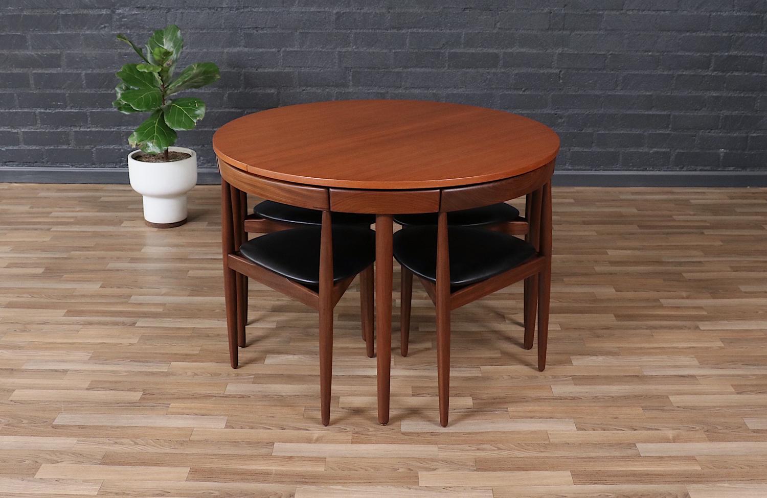 Dimensions

Table: 29in H x 41.50in -61 Wx 41.50in D 
Chairs: 28in H x 19.50in W x 18in D 
Seat Height 18in

This exceptional Mid-Century Danish Modern dining set, designed by Hans Olsen for Frem Røjle in the 1950s, showcases innovative